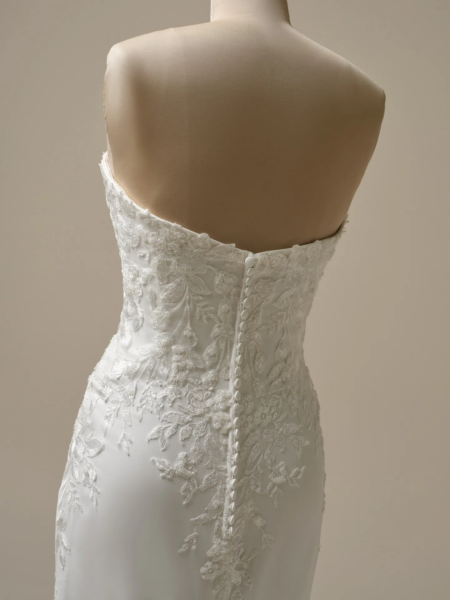 Maggie Sottero Yara back view, lace detailing on crepe sheath wedding dress.