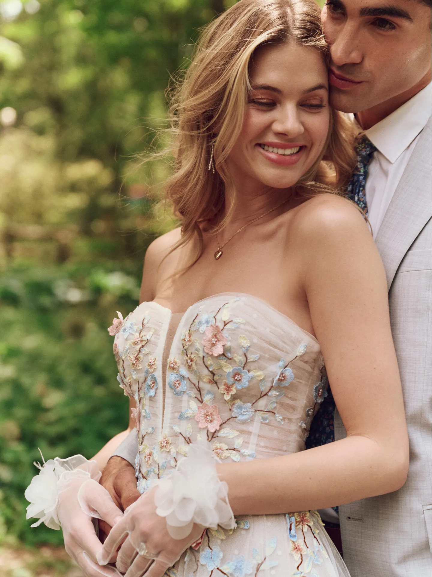 Maggie Sottero Zephyrine front view, floral A-line gown, outdoor setting