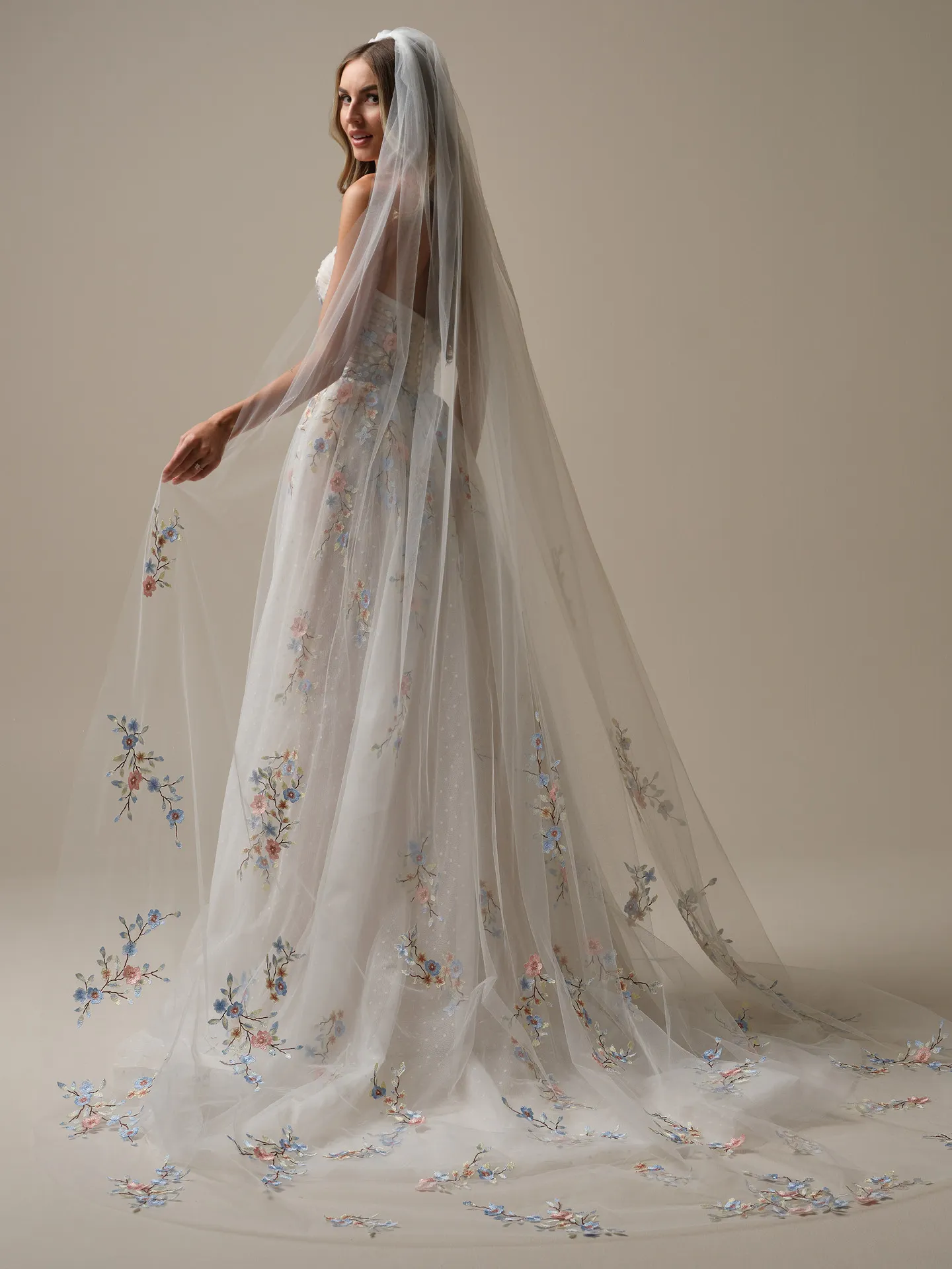 Maggie Sottero Zephyrine side view colorful floral A-line wedding gown with veil