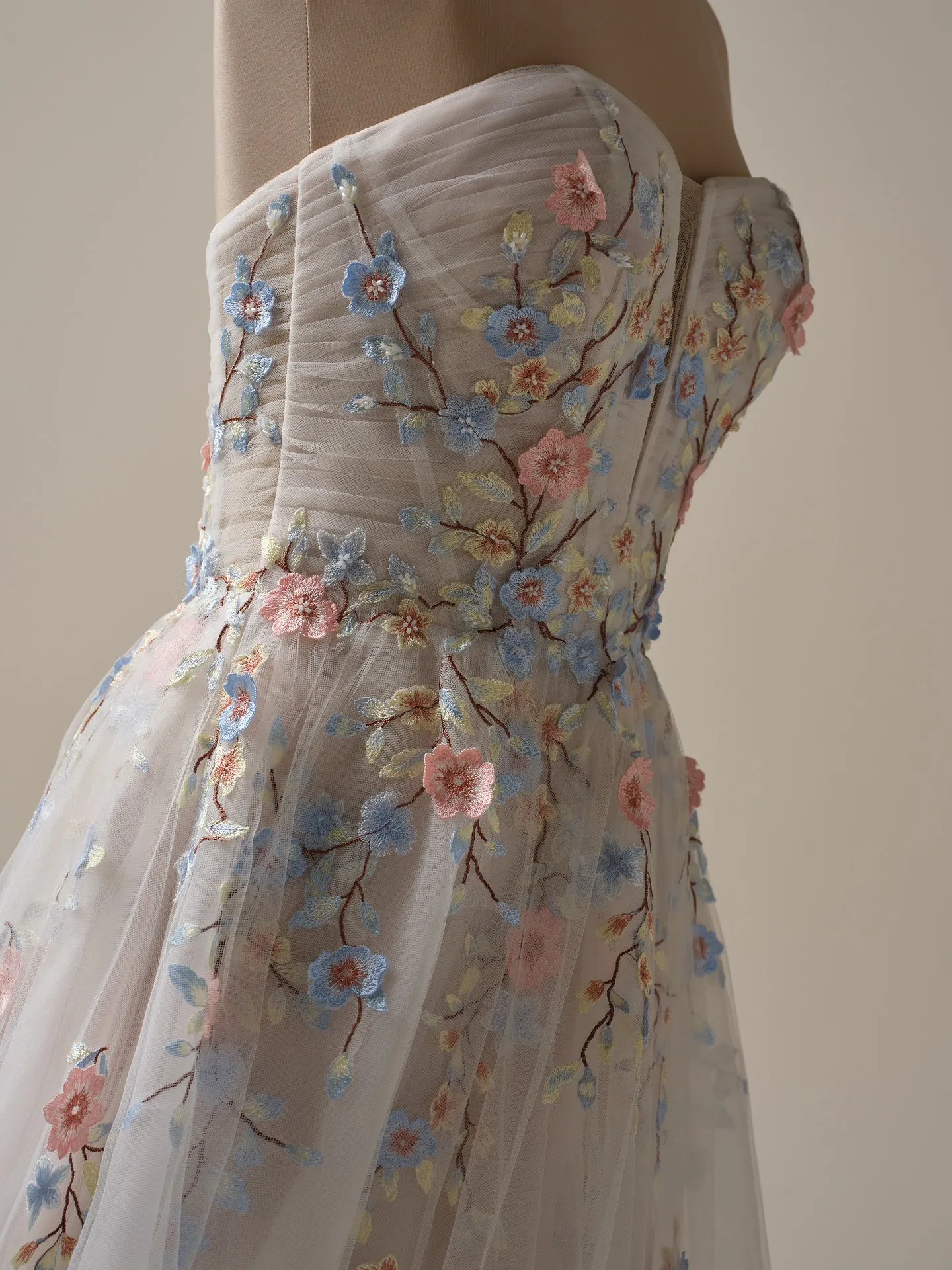 Maggie Sottero Zephyrine colorful floral A-line gown side view.