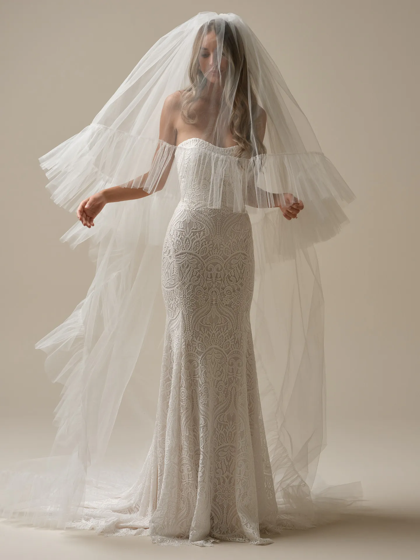 Rebecca Ingram dress with cathedral veil and ruffle edge detail front view.