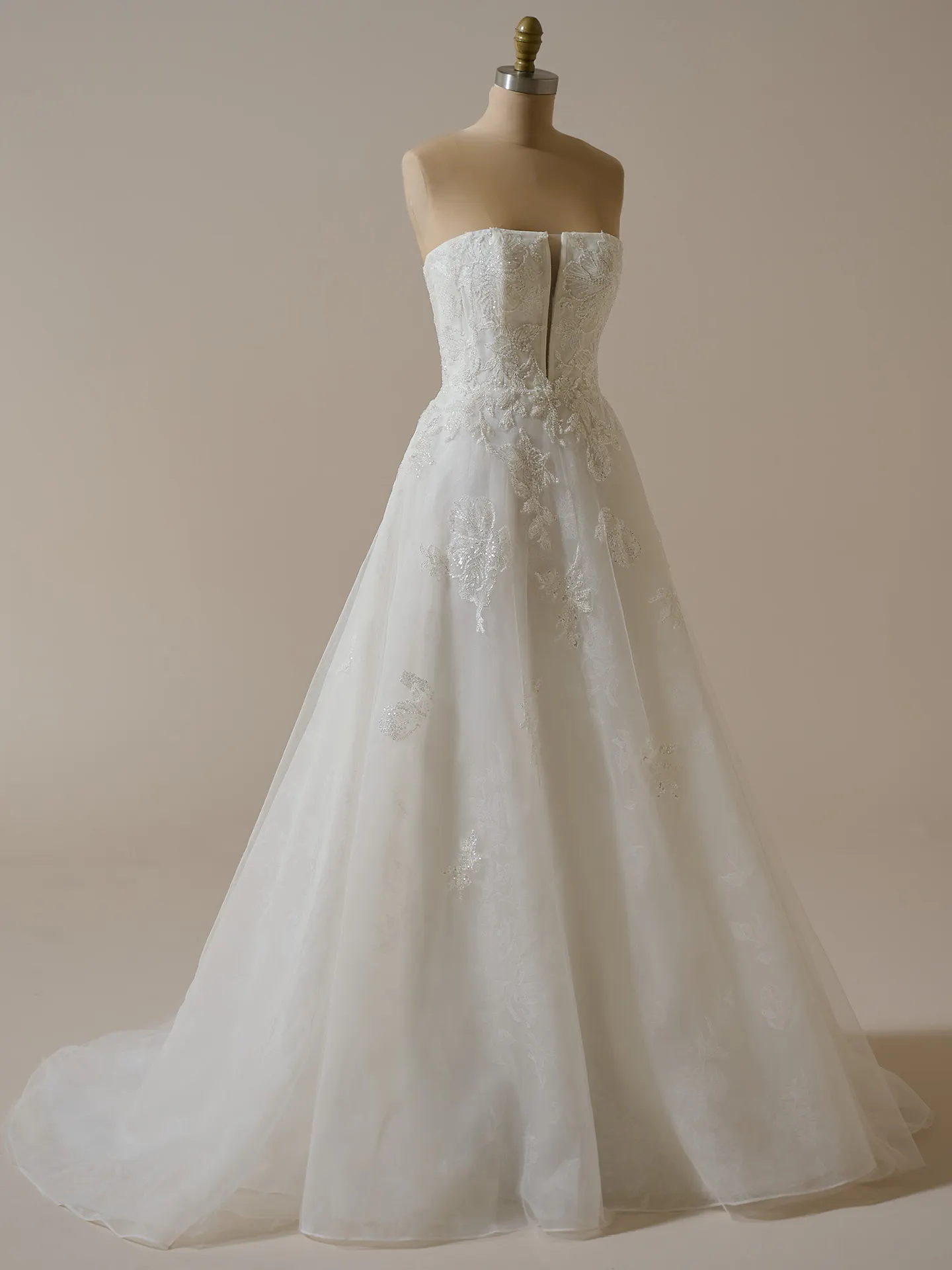 Maggie Sottero Billie front view floral organza A-line bridal gown on mannequin