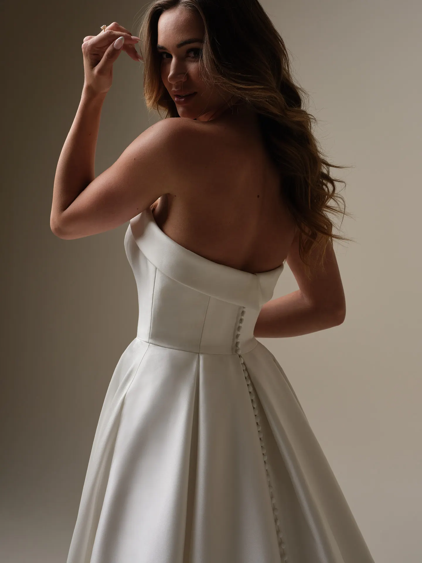 Rebecca Ingram Elizabeth Marie back view satin A-line bridal dress with banded cuff