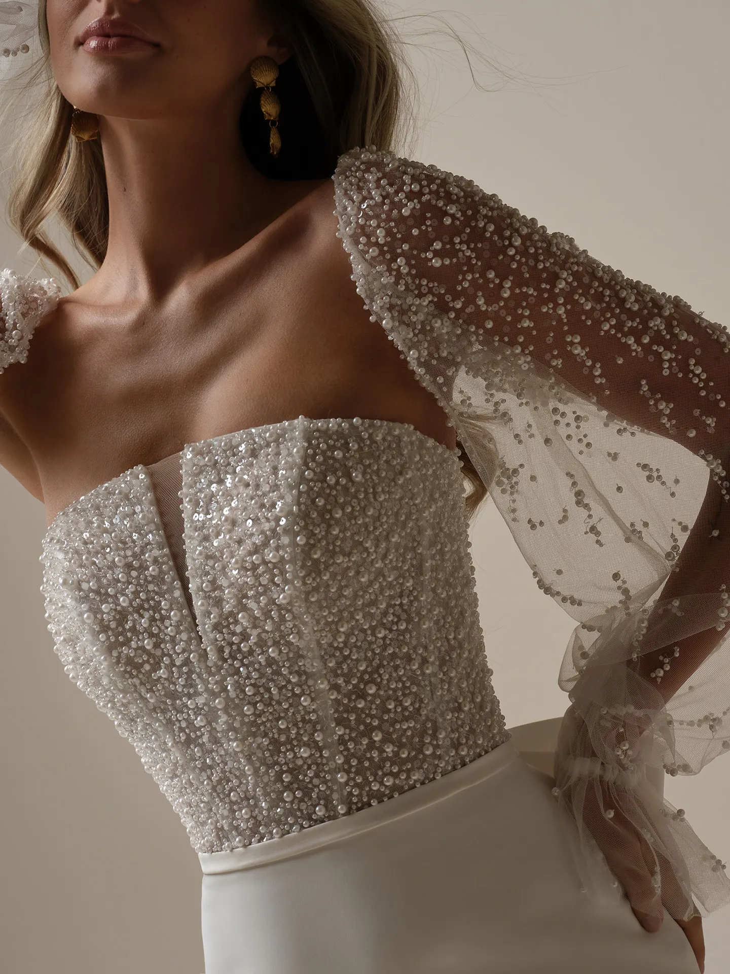 Rebecca Ingram Heyda front view with pearl-studded illusion sleeves.