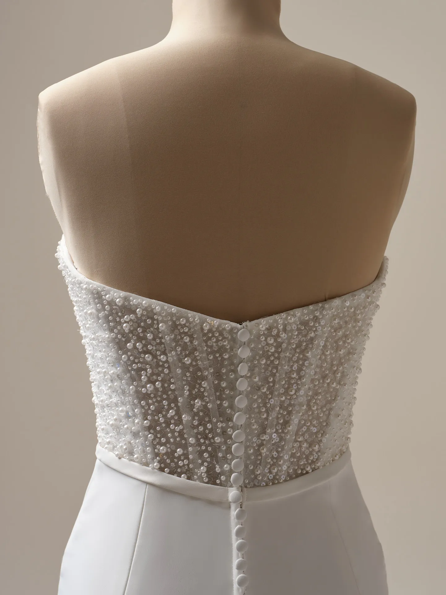 Rebecca Ingram Heyda wedding dress back view with beaded satin detail