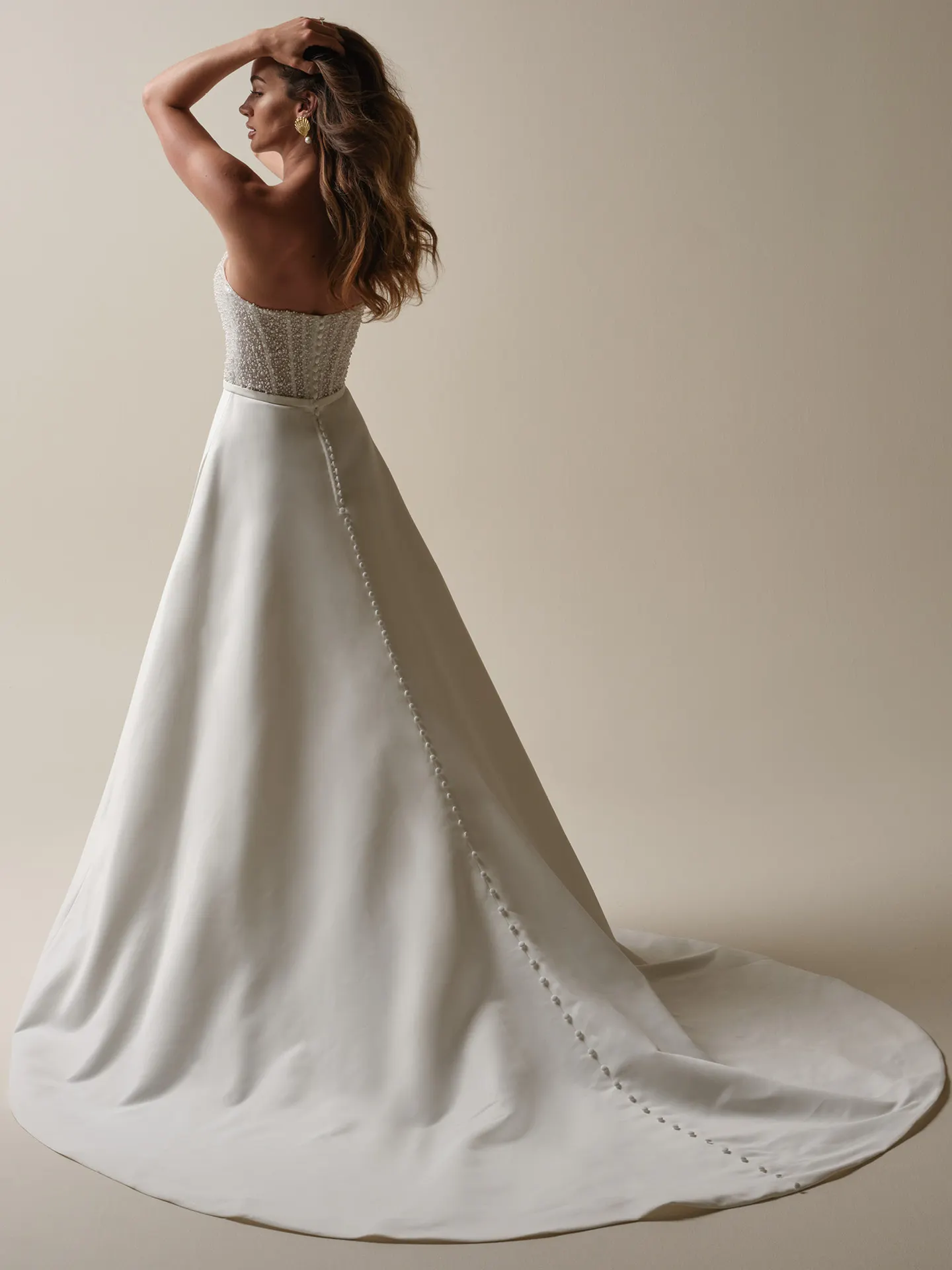 Rebecca Ingram Heyda Lane back view A-line wedding dress with beading and satin fabric