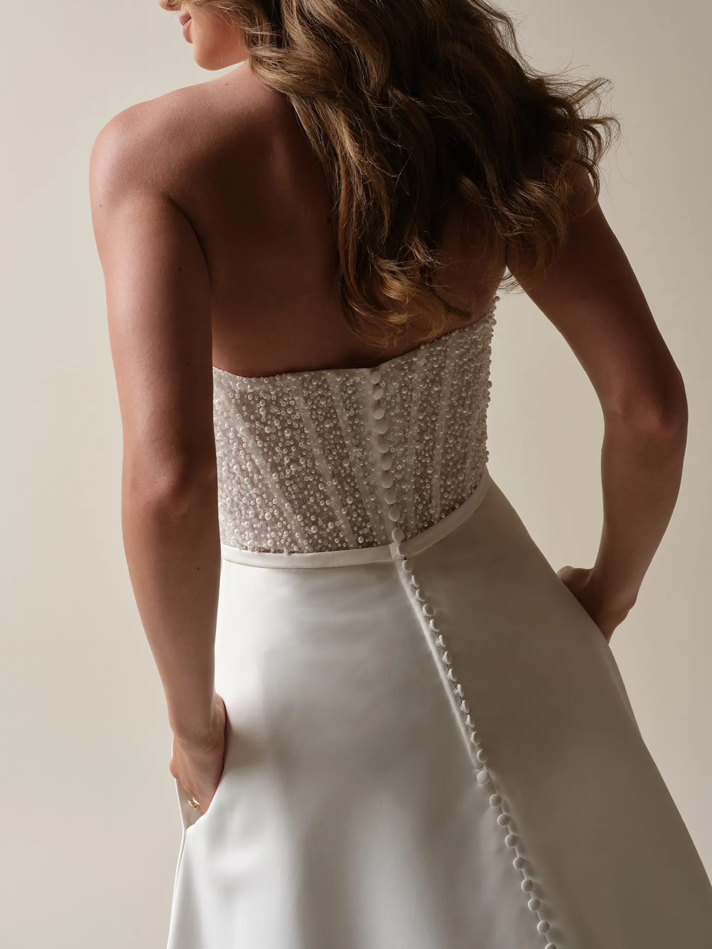 Rebecca Ingram Heyda Lane back view satin A-line wedding dress with beaded bodice