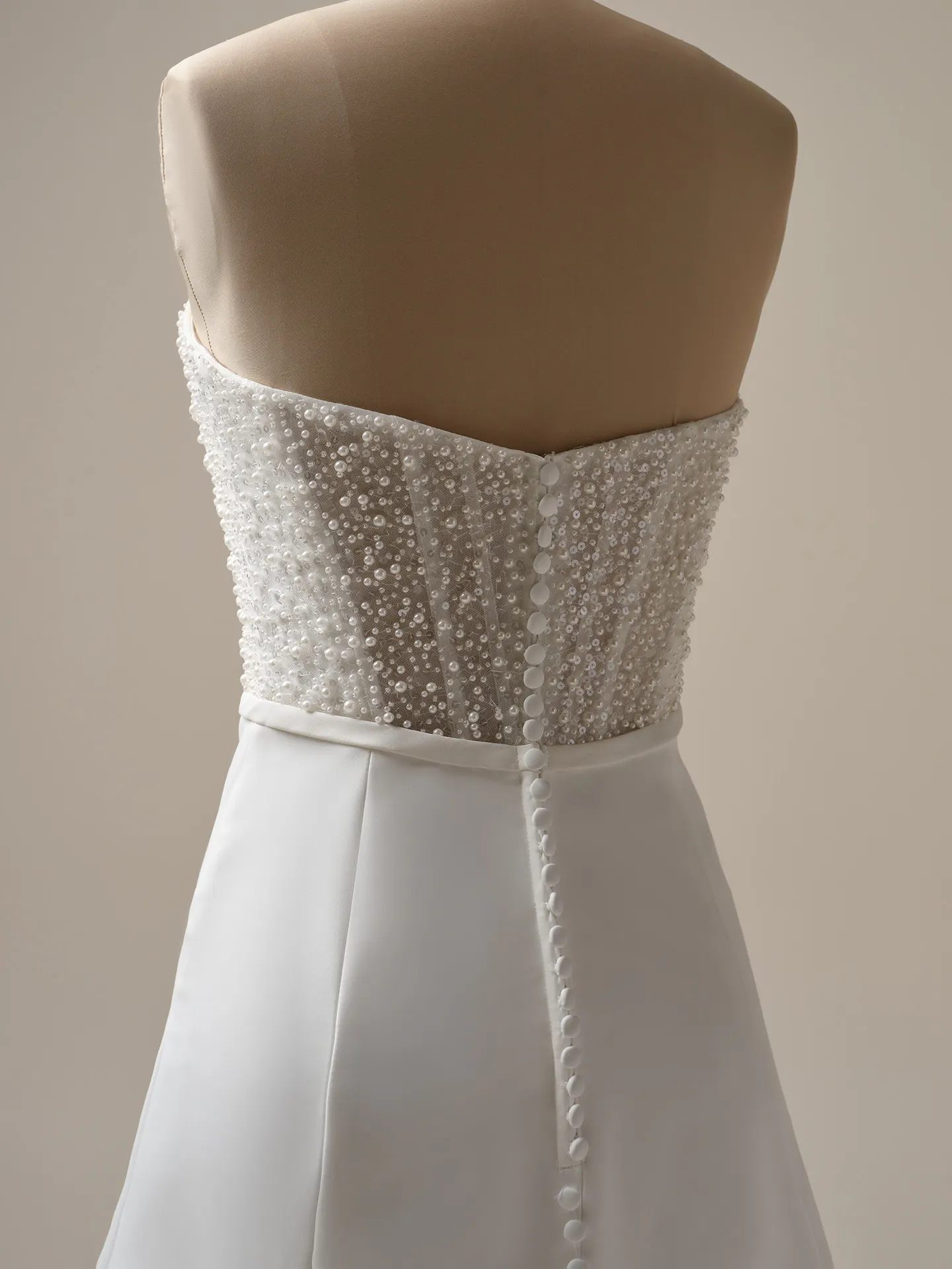 Rebecca Ingram Heyda Lane back view beaded pearl satin A-line wedding dress