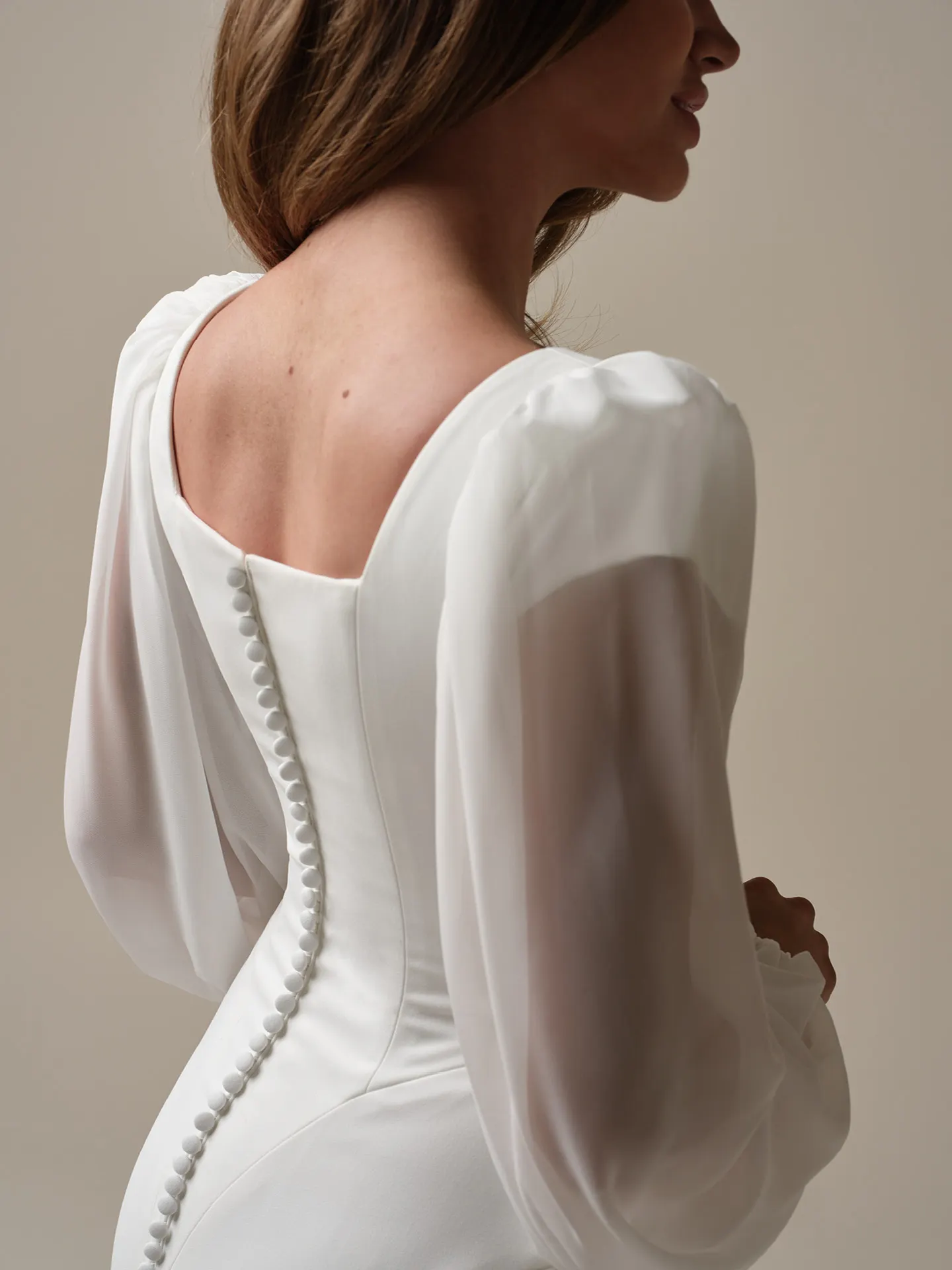 Maggie Sottero Jorie back view, square neckline, button detail, sheer sleeves.