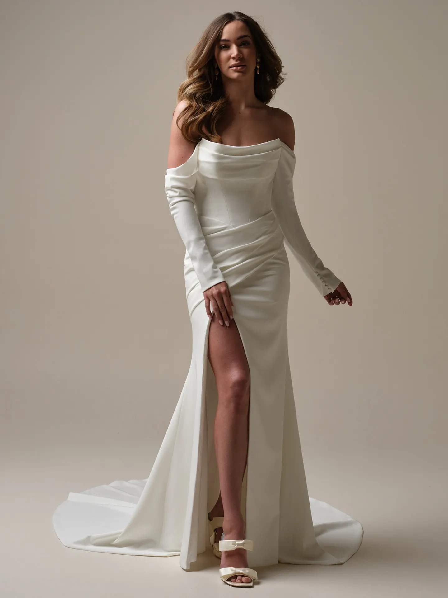 Rebecca Ingram Kailani front view, off-shoulder, high slit, detachable sleeves, draped detail.