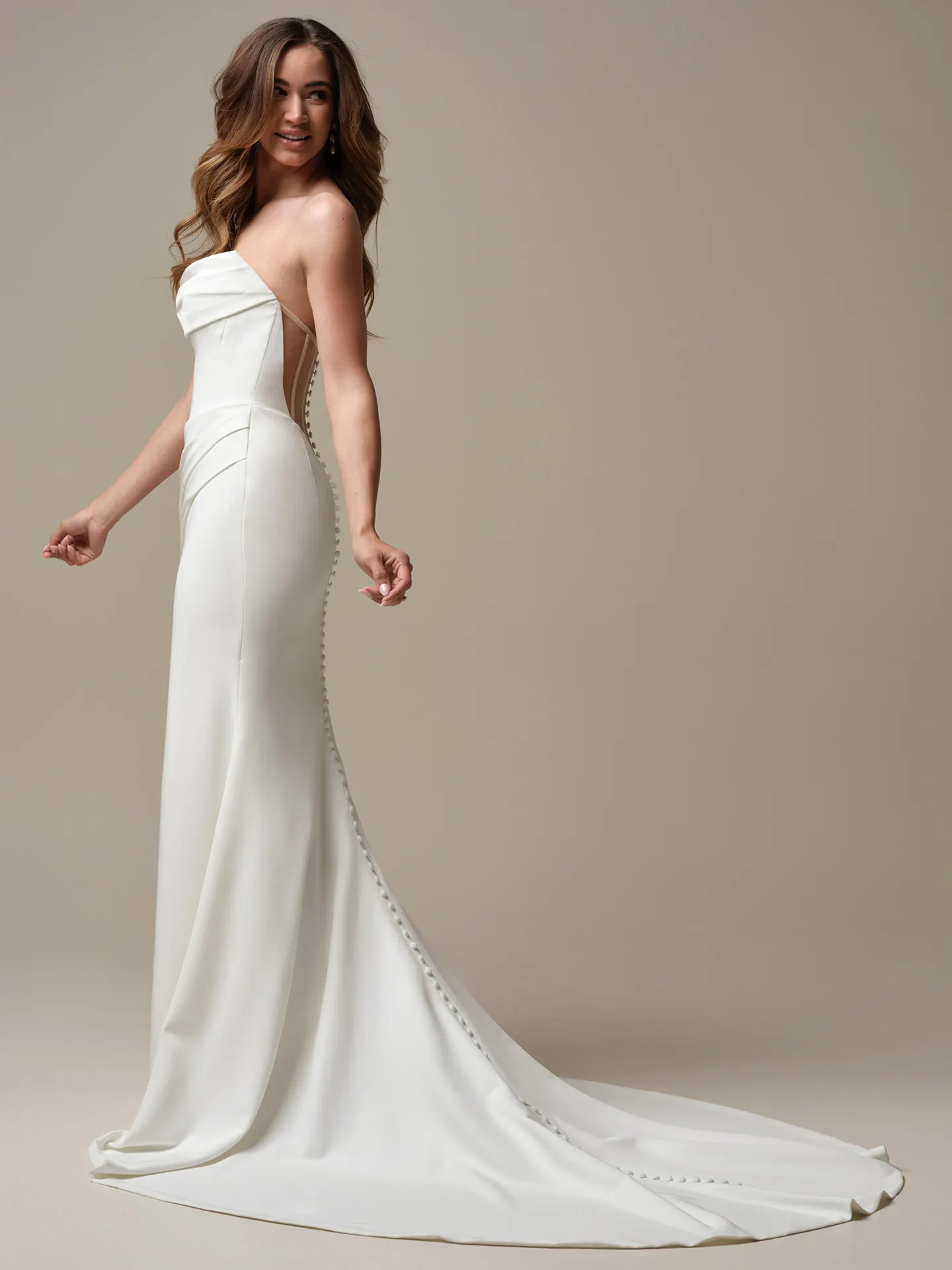 Maggie Sottero Kailani side view, elegant crepe wedding dress with cowl back and button detail