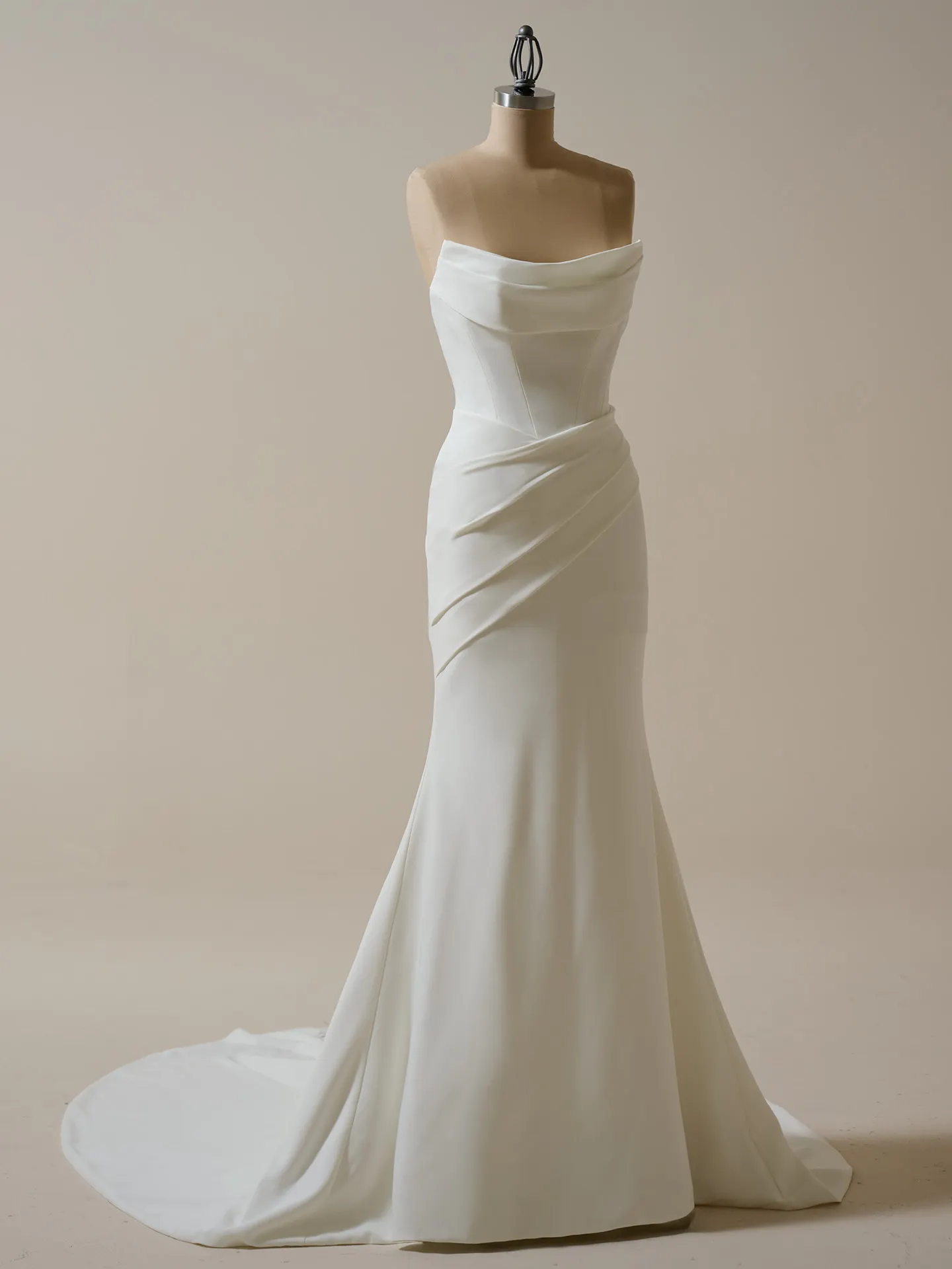 Maggie Sottero Kailani front view crepe cowl A-line wedding dress on mannequin.
