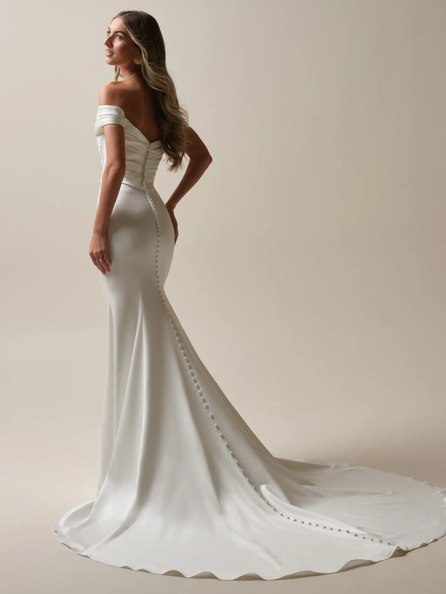 Maggie Sottero Latoya back view satin mermaid dress with buttons