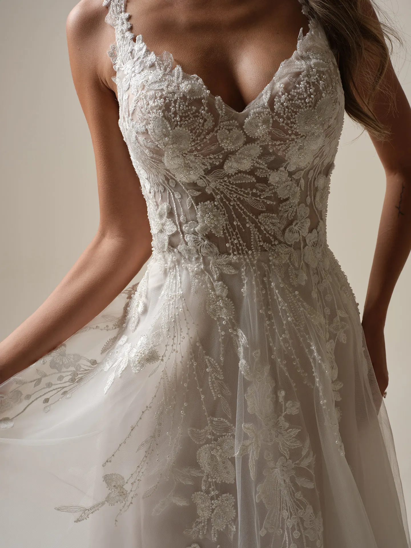 Rebecca Ingram Maple front view A-line bridal gown with beaded pearl V-neck.