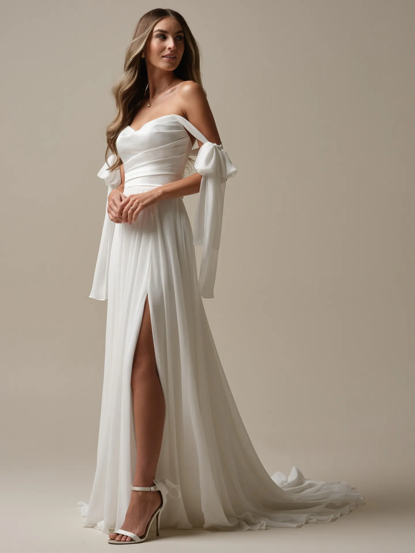 Rebecca Ingram Melody side view: sheath wedding dress with slit and detachable chiffon straps.
