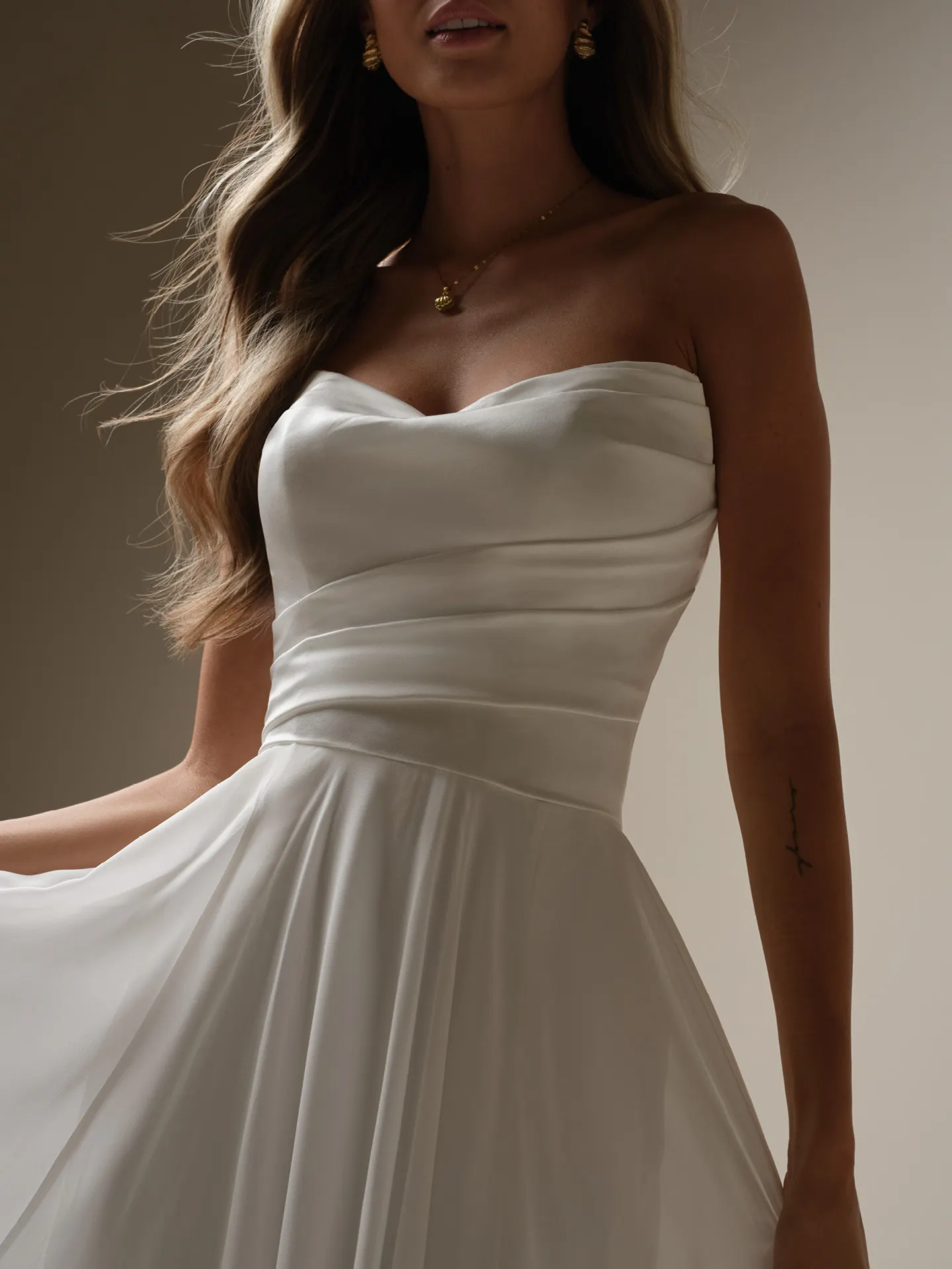 Rebecca Ingram Melody front view, draped strapless chiffon A-line dress