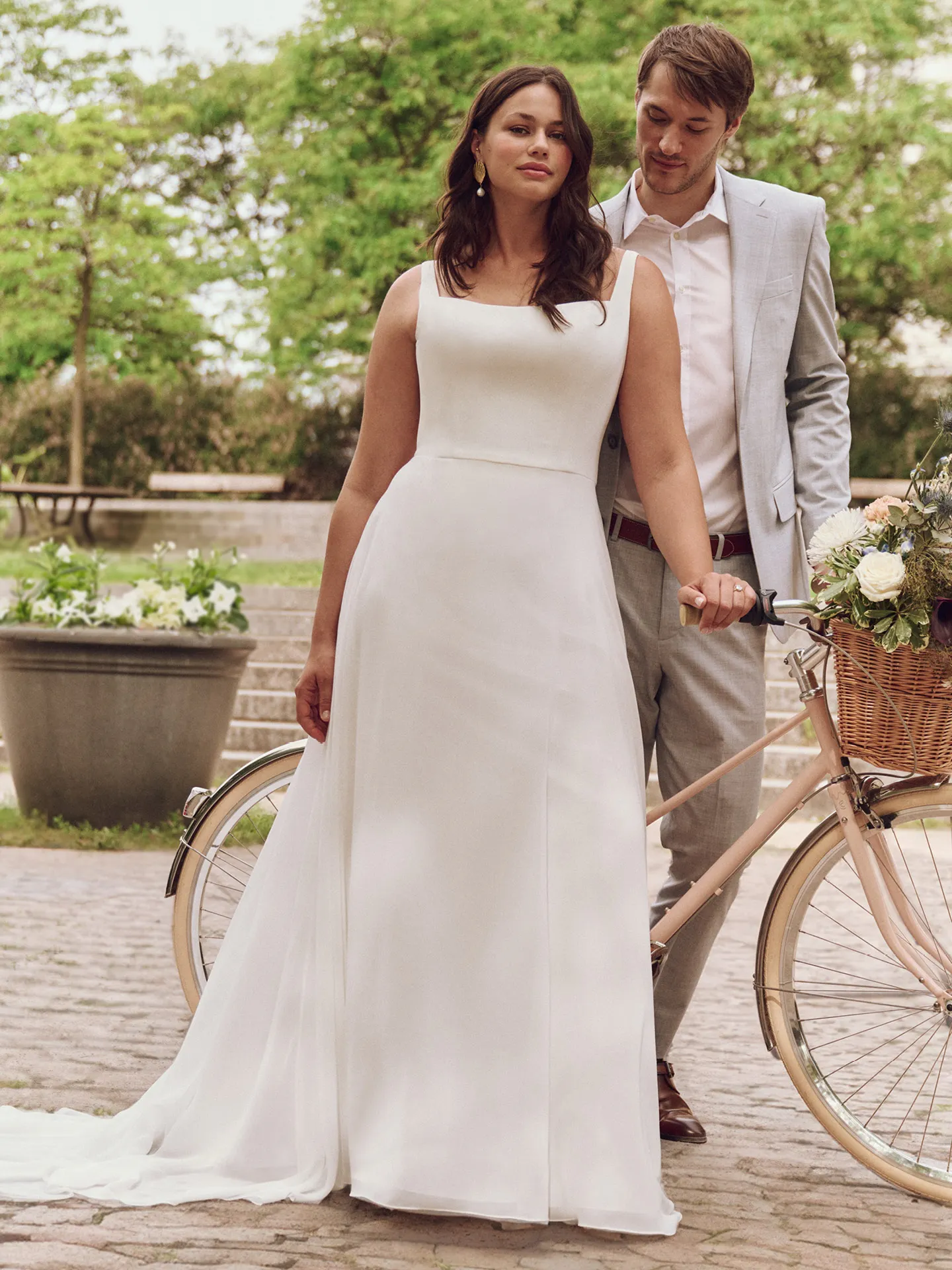 Rebecca Ingram Olivianna A-line bridal dress front view with square neck in garden setting