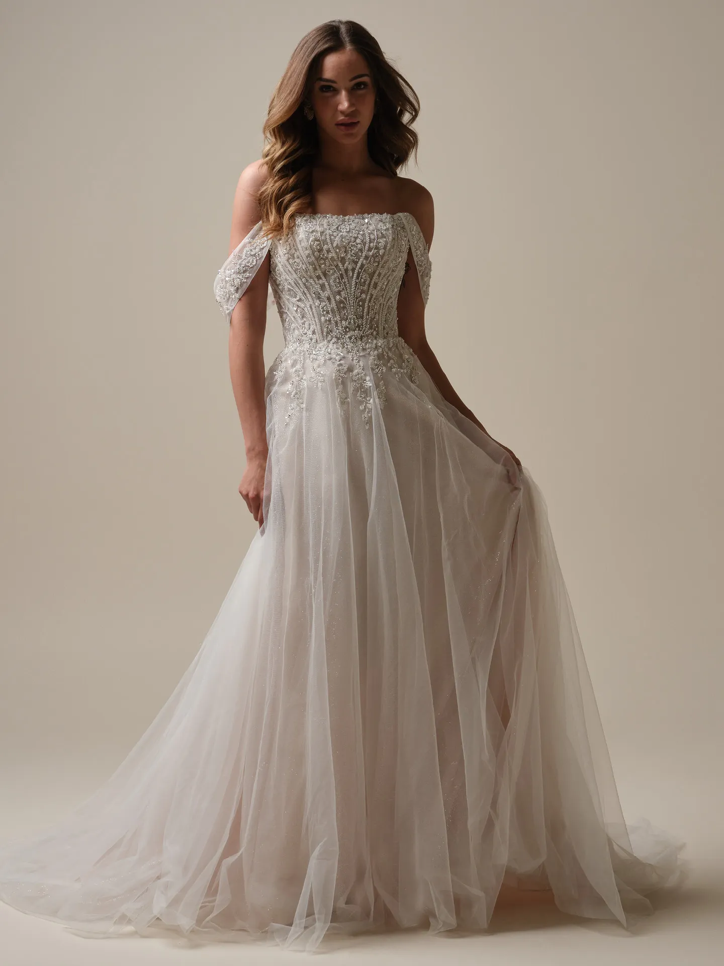 Maggie Sottero Yvette front view with cap sleeves and sequin embellishment