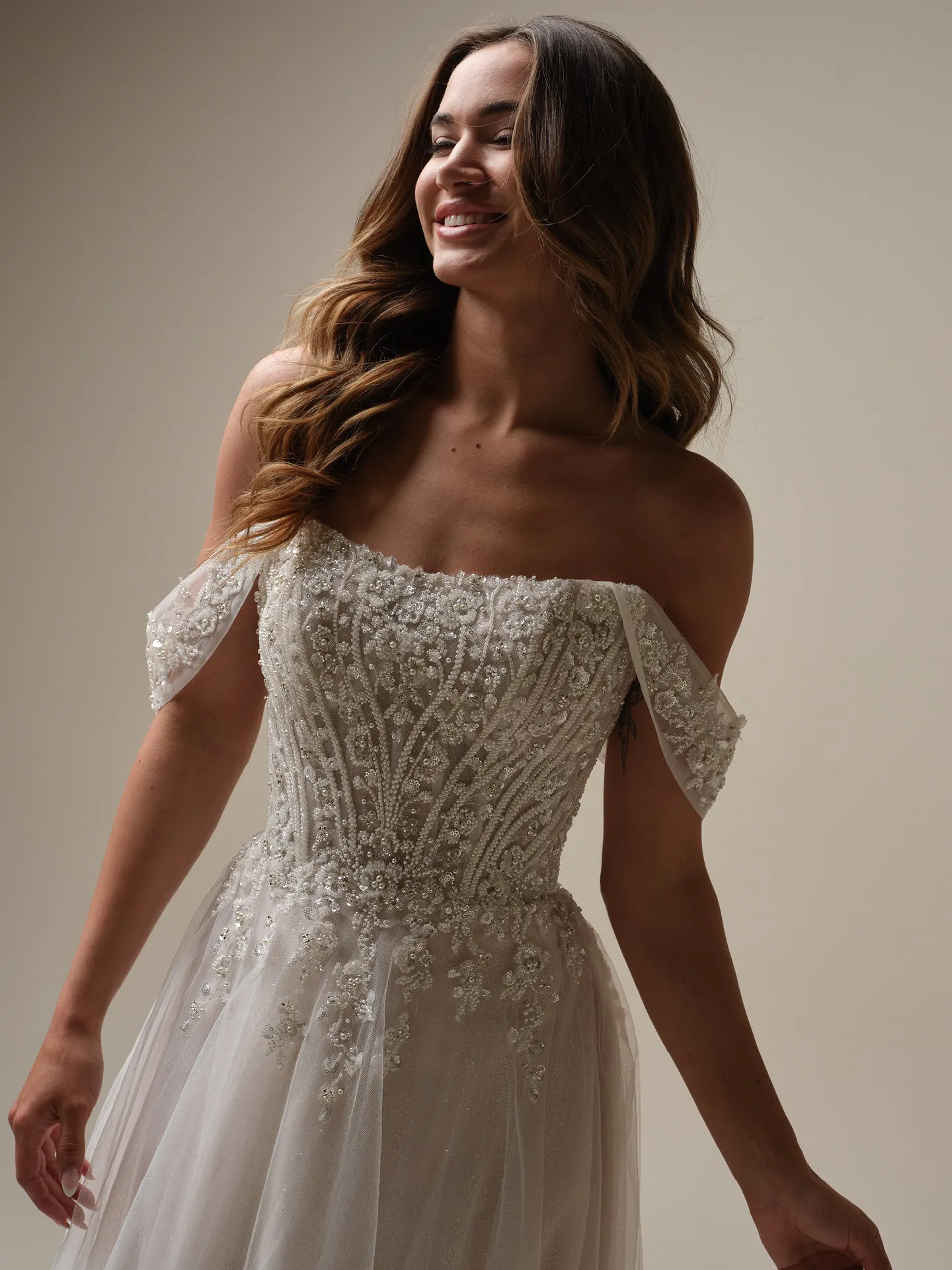 Maggie Sottero Yvette front view with sequin embellishment and cap sleeves
