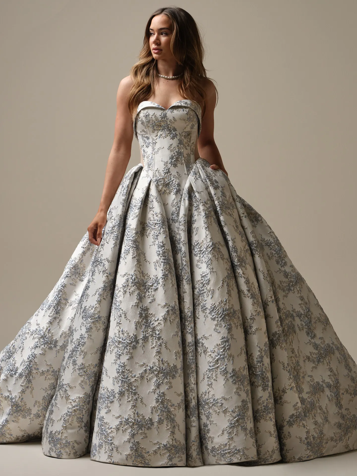 Sottero and Midgley Aberdeen ballgown front view with blue floral jacquard design.