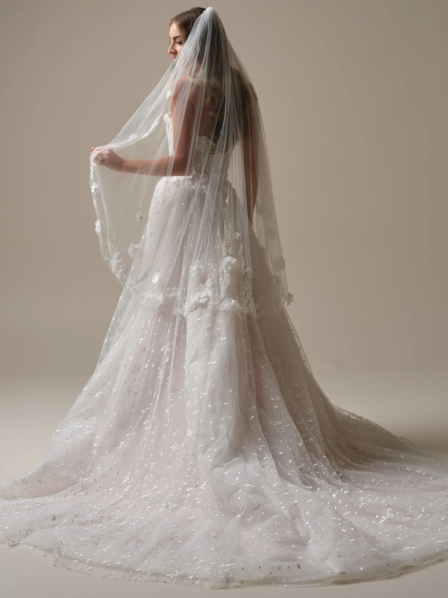 Sottero and Midgley veil side view with beaded 3-D lace motifs.