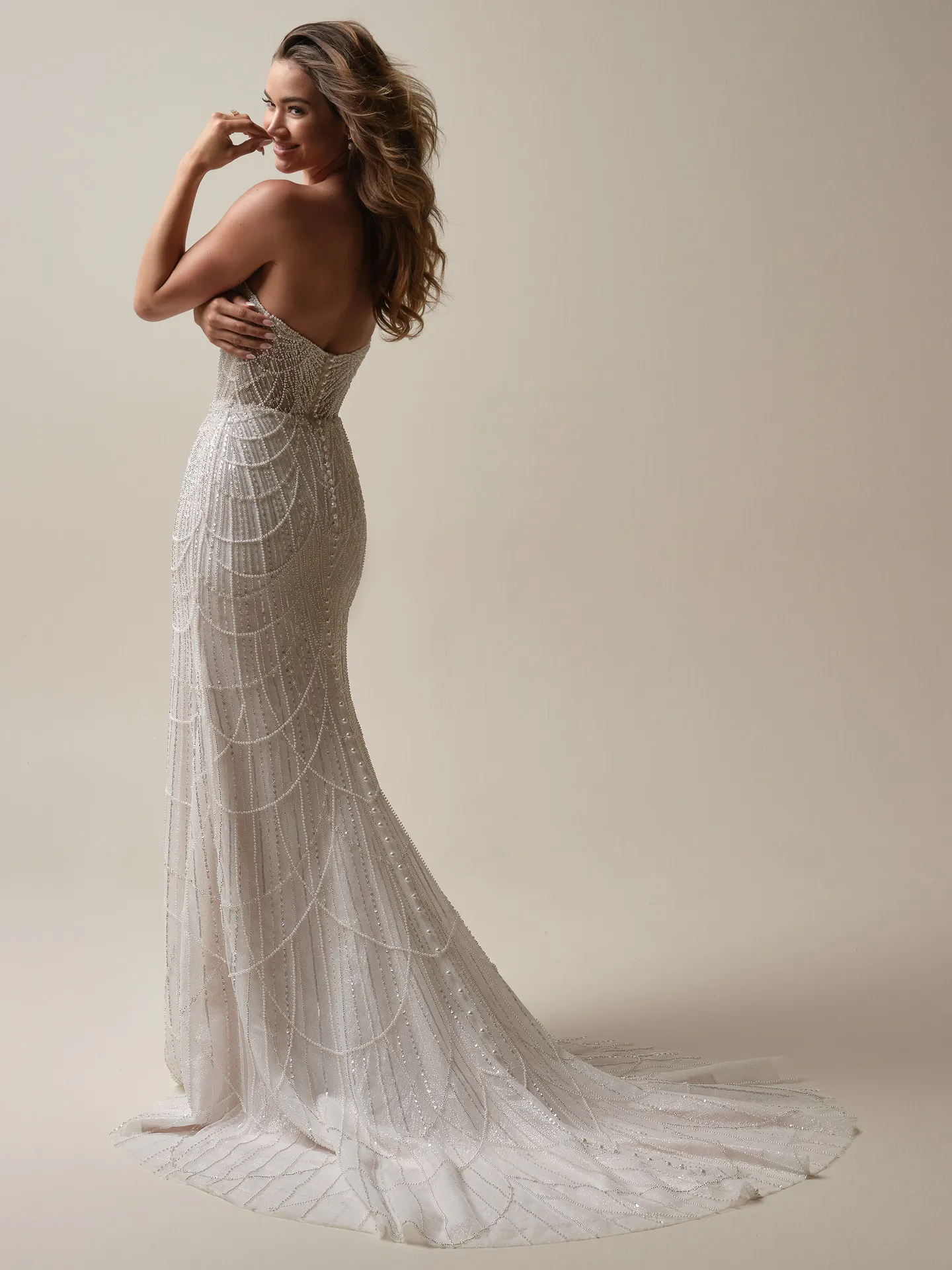 Maggie Sottero Constance sheath gown back view with draped pearls