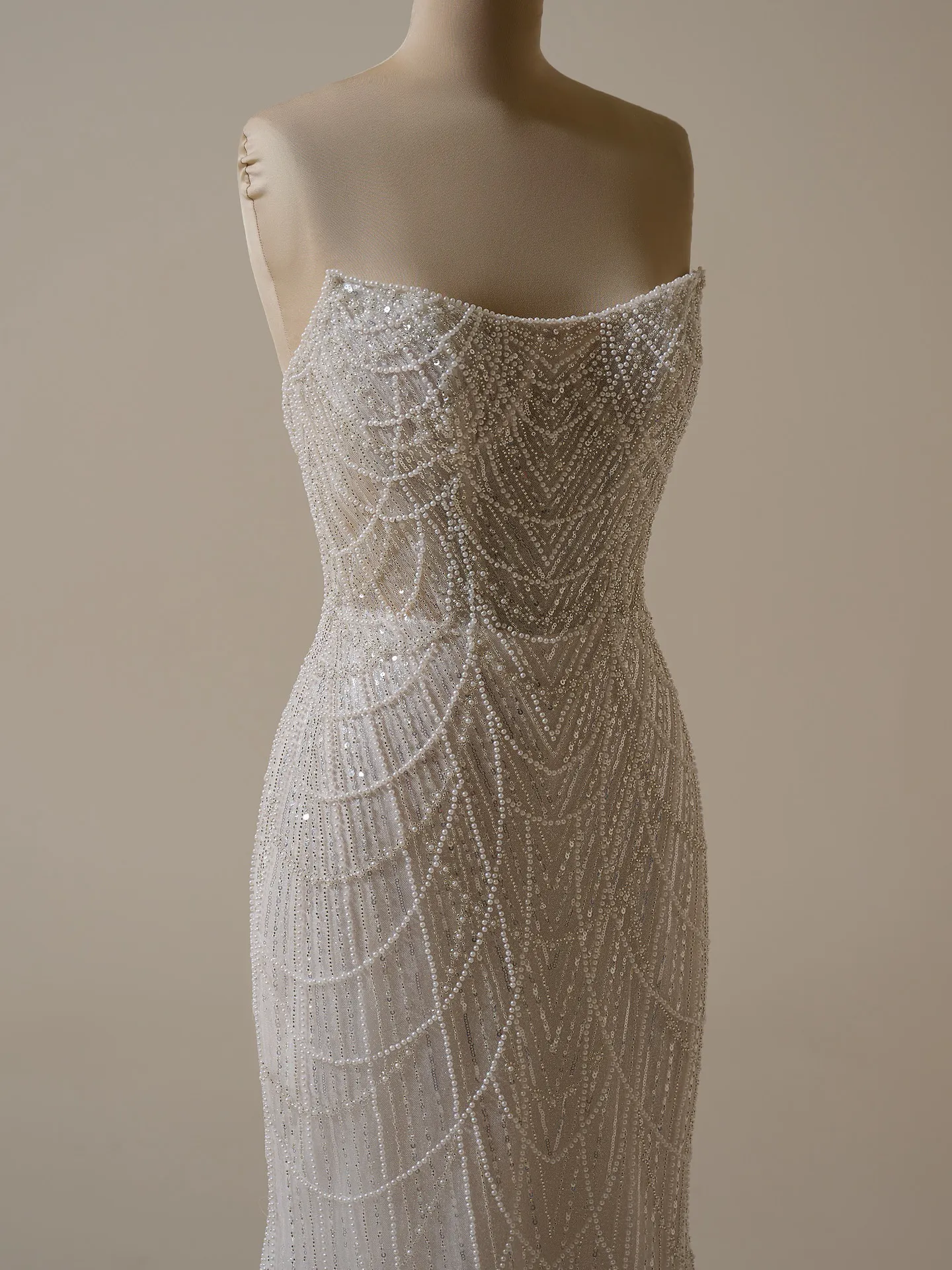 Maggie Sottero Constance sheath gown with draped pearls front view