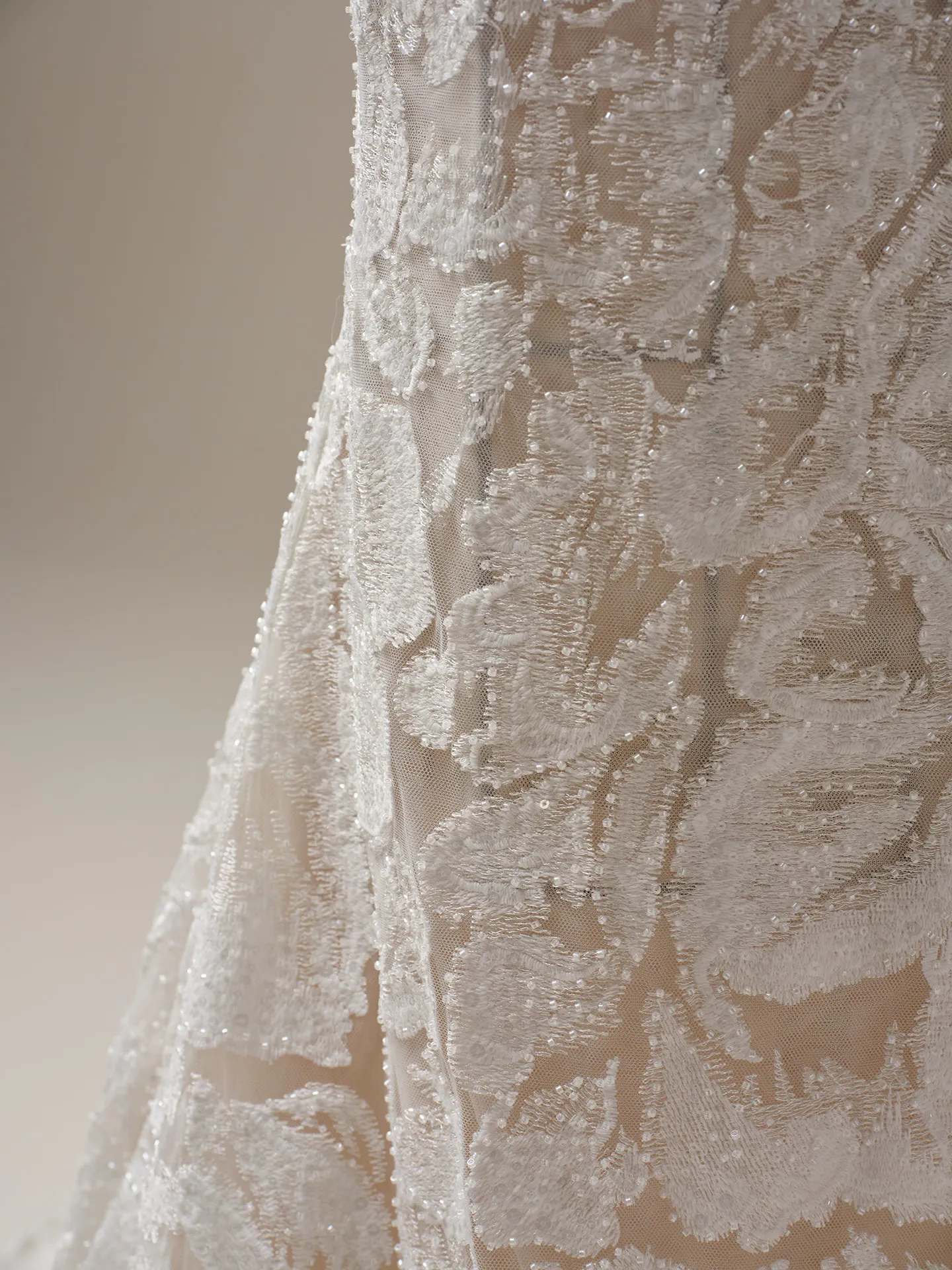Sottero and Midgley Holland close-up of turtleneck illusion lace sheath gown detailing