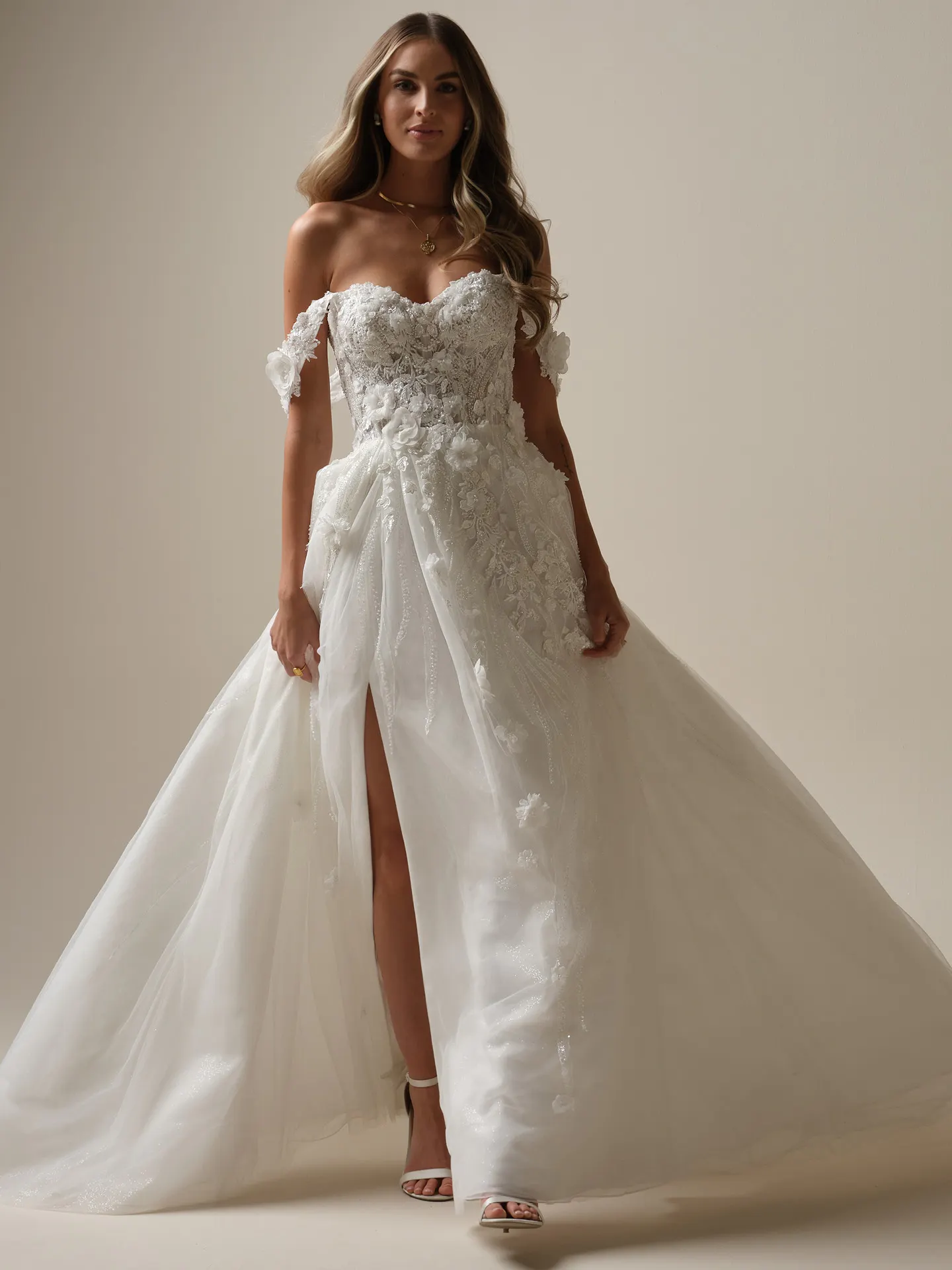 Sottero and Midgley Logan front view, off-shoulder lace dress with slit and tulle skirt.
