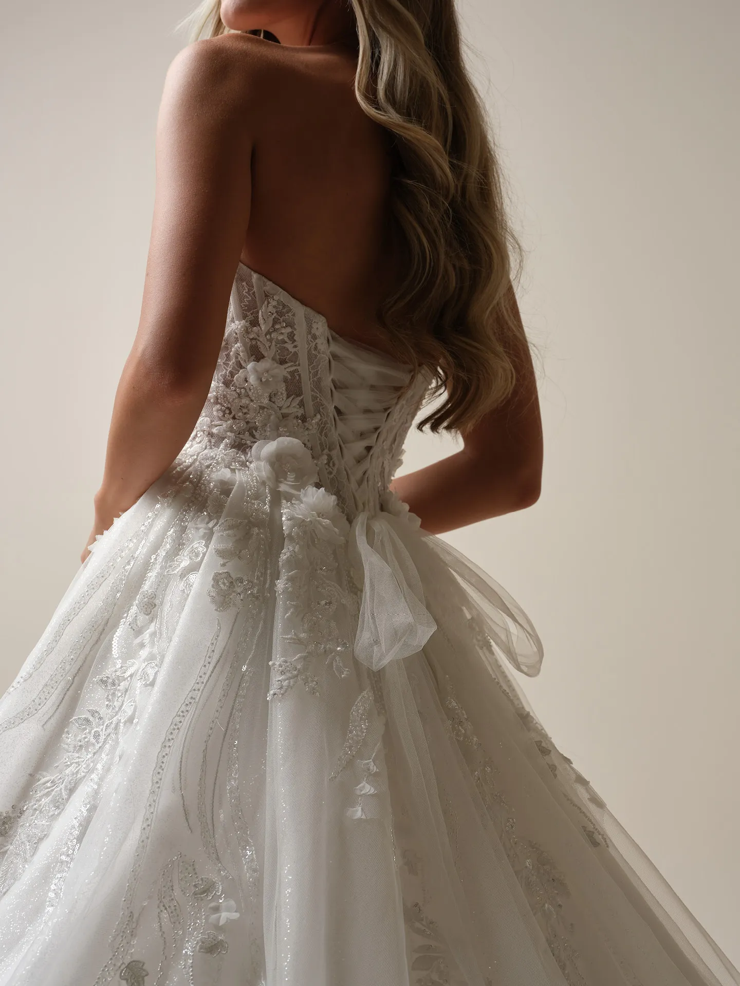 Maggie Sottero Logan back view lace-up beaded A-line wedding dress