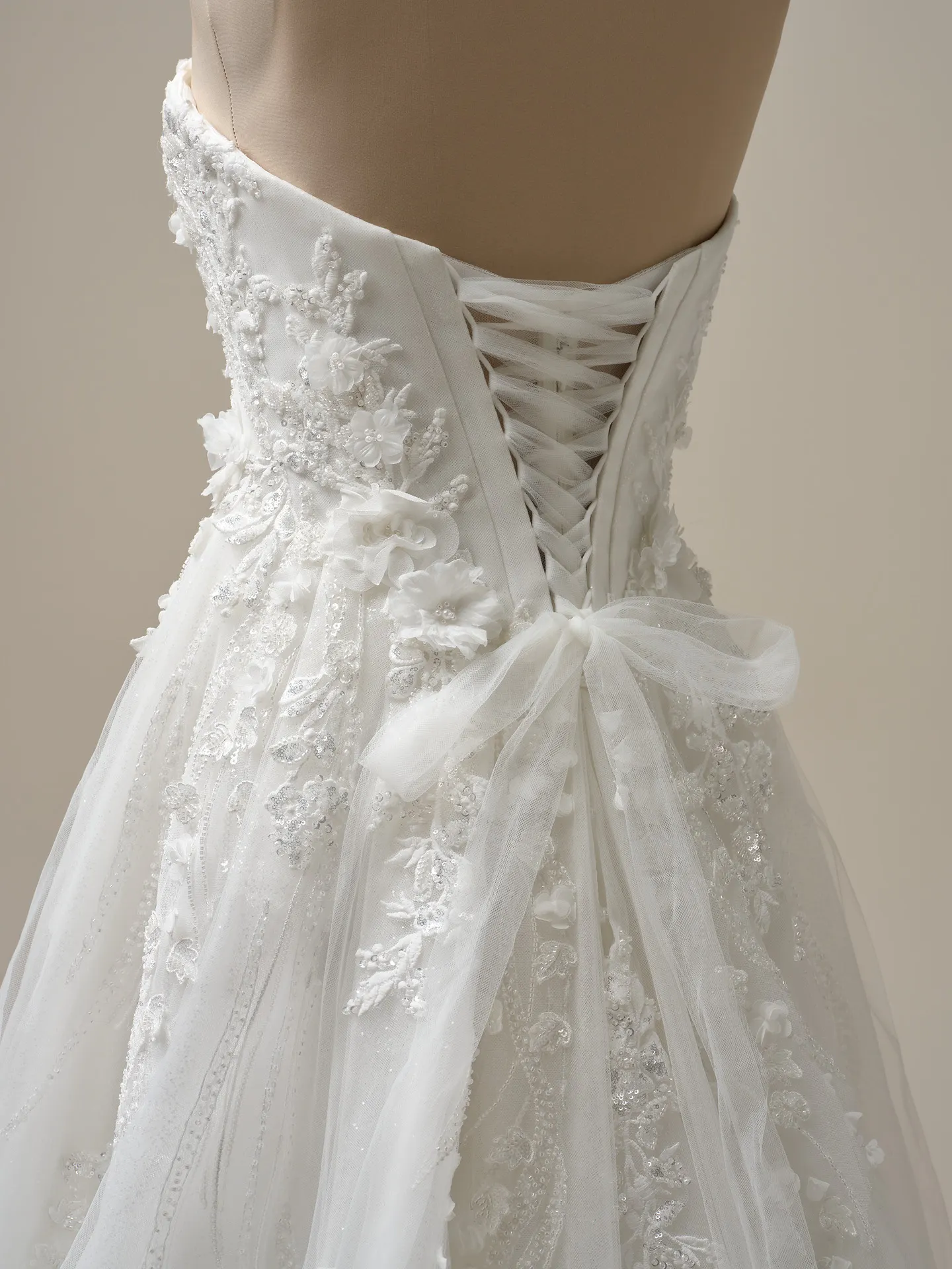 Maggie Sottero Logan back view lace-up beaded A-line wedding dress