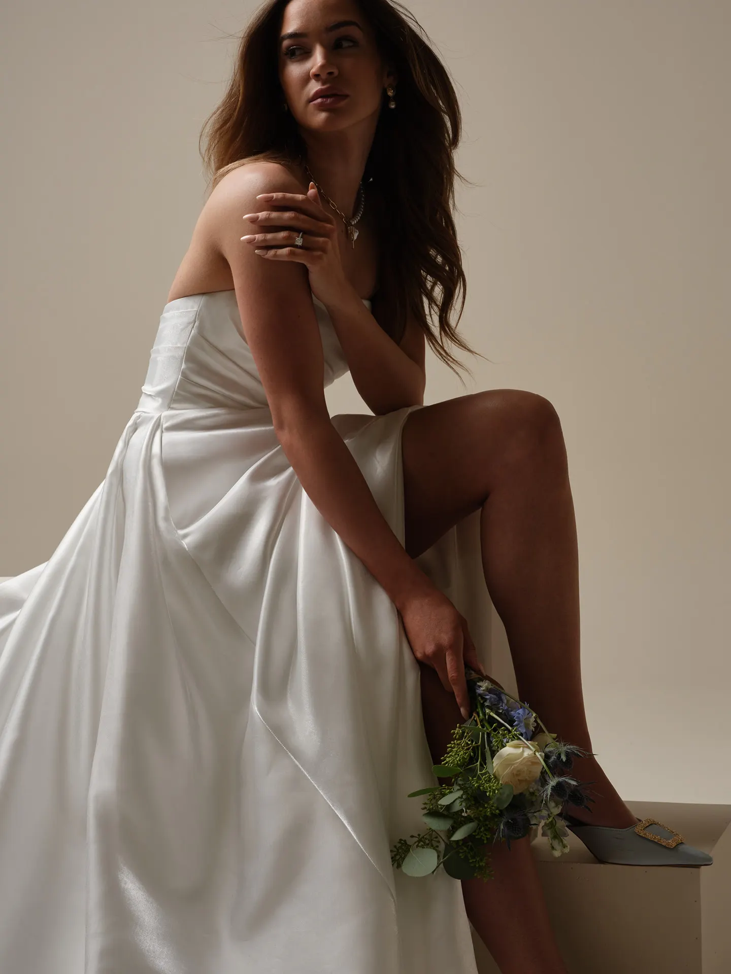 Sottero and Midgley Mirabella A-line wedding dress side view with flower bouquet