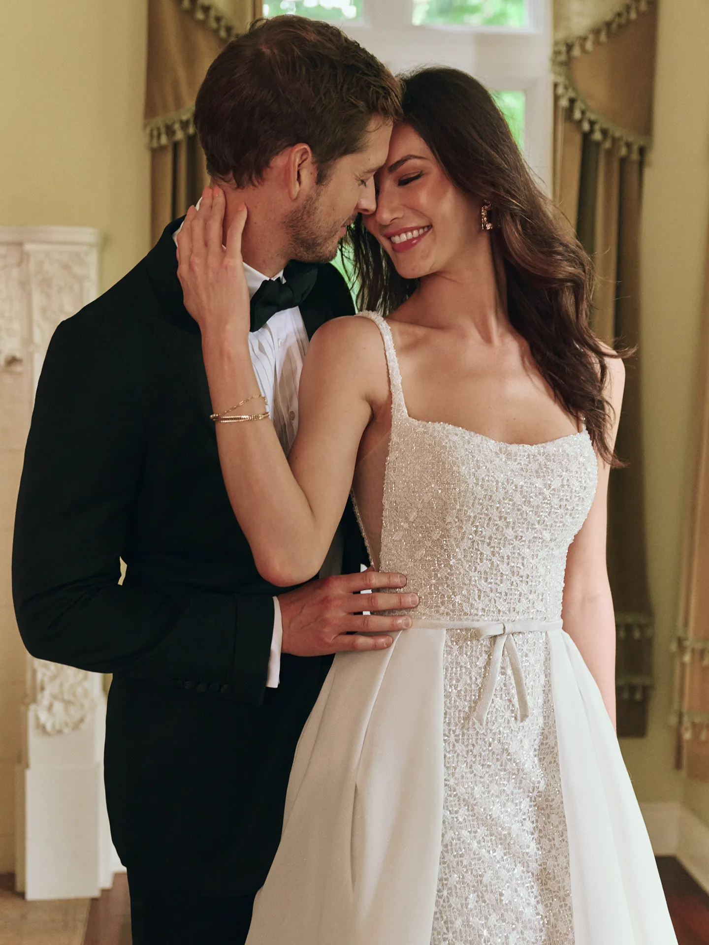 Maggie Sottero Star glittering sheath bridal gown with bow front view
