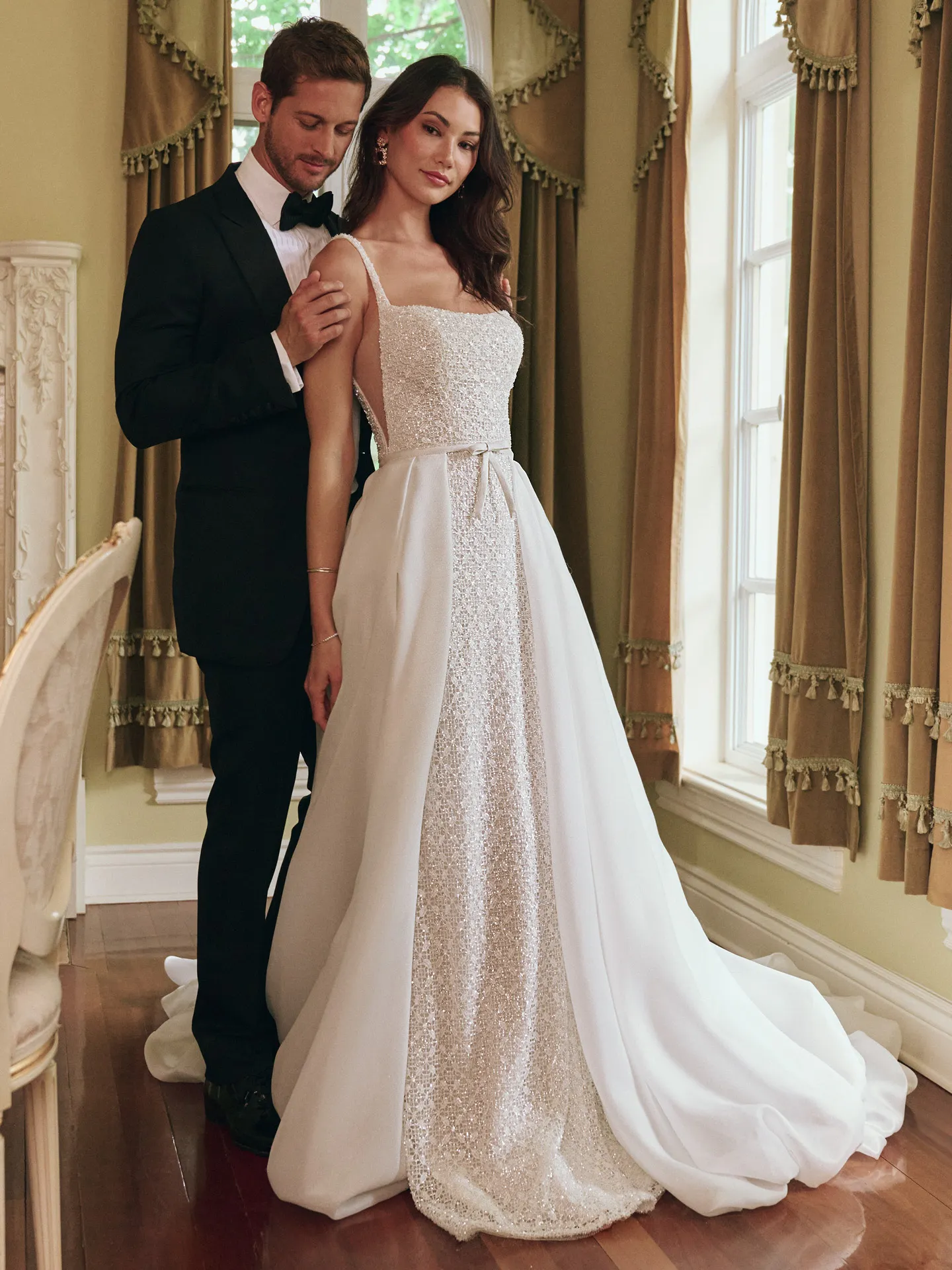 Maggie Sottero star glittering sheath bridal gown with bow front view