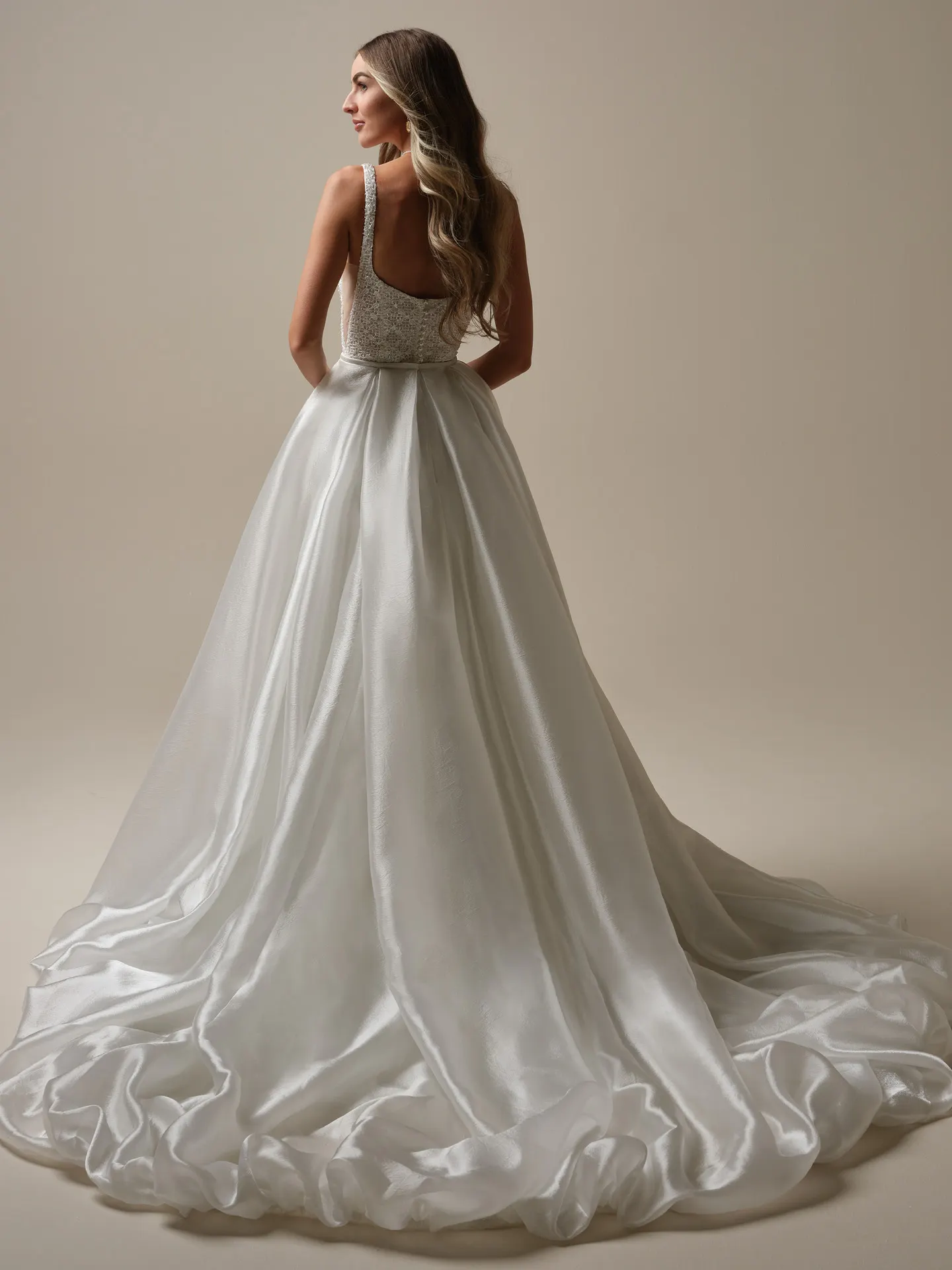 Sottero and Midgley gown back view with detachable tulle train and bow detail.