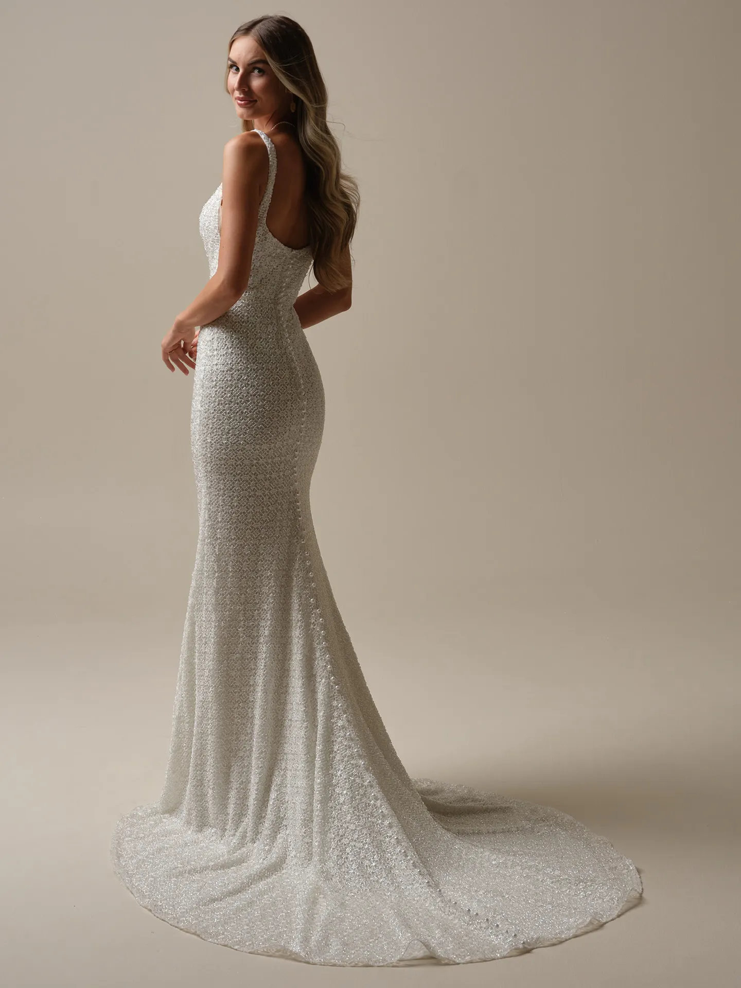Maggie Sottero Star glitter sheath gown with bow back view