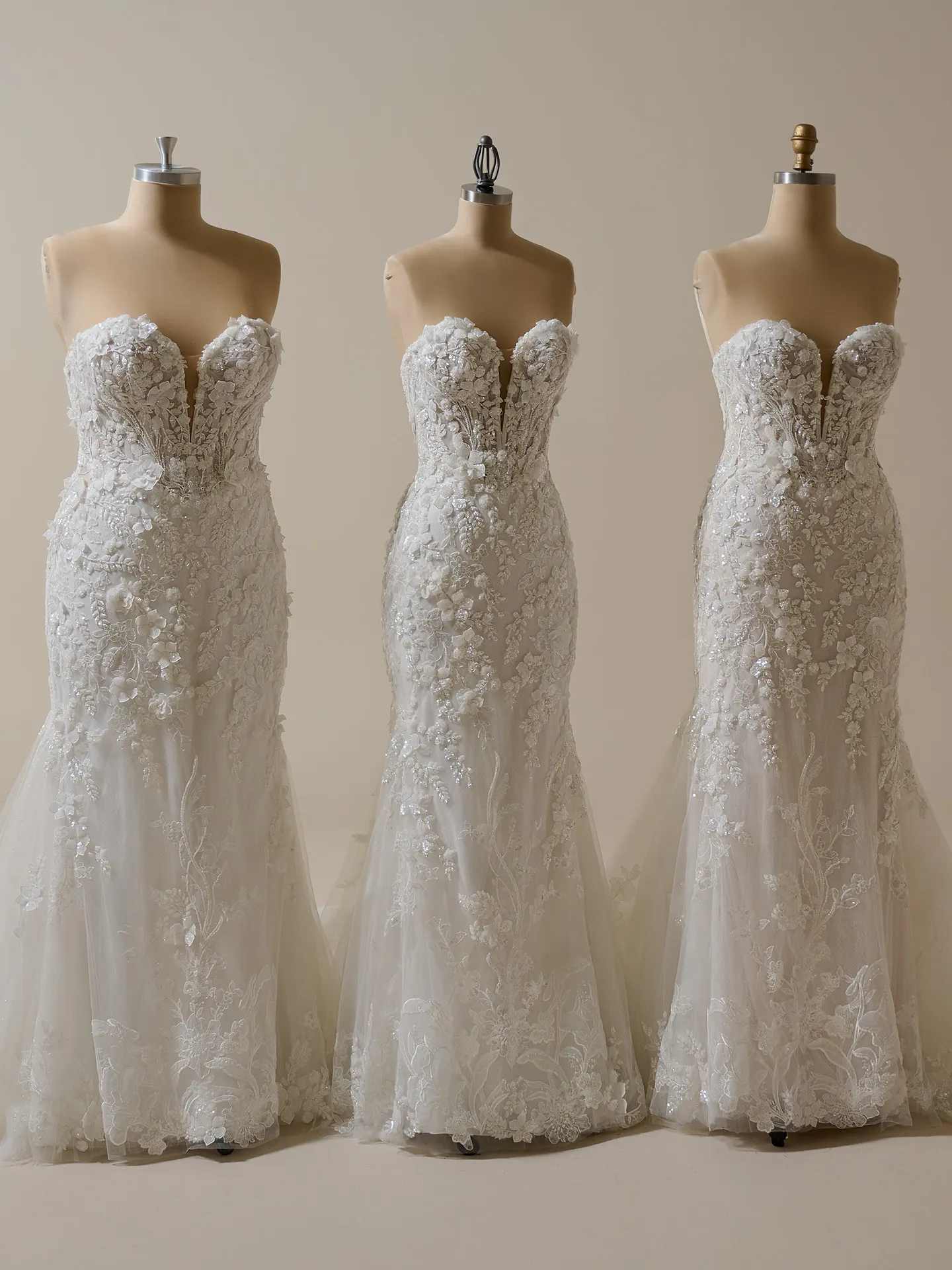 Sottero and Midgley Twilight, backless glitter tulle mermaid dress on mannequins.