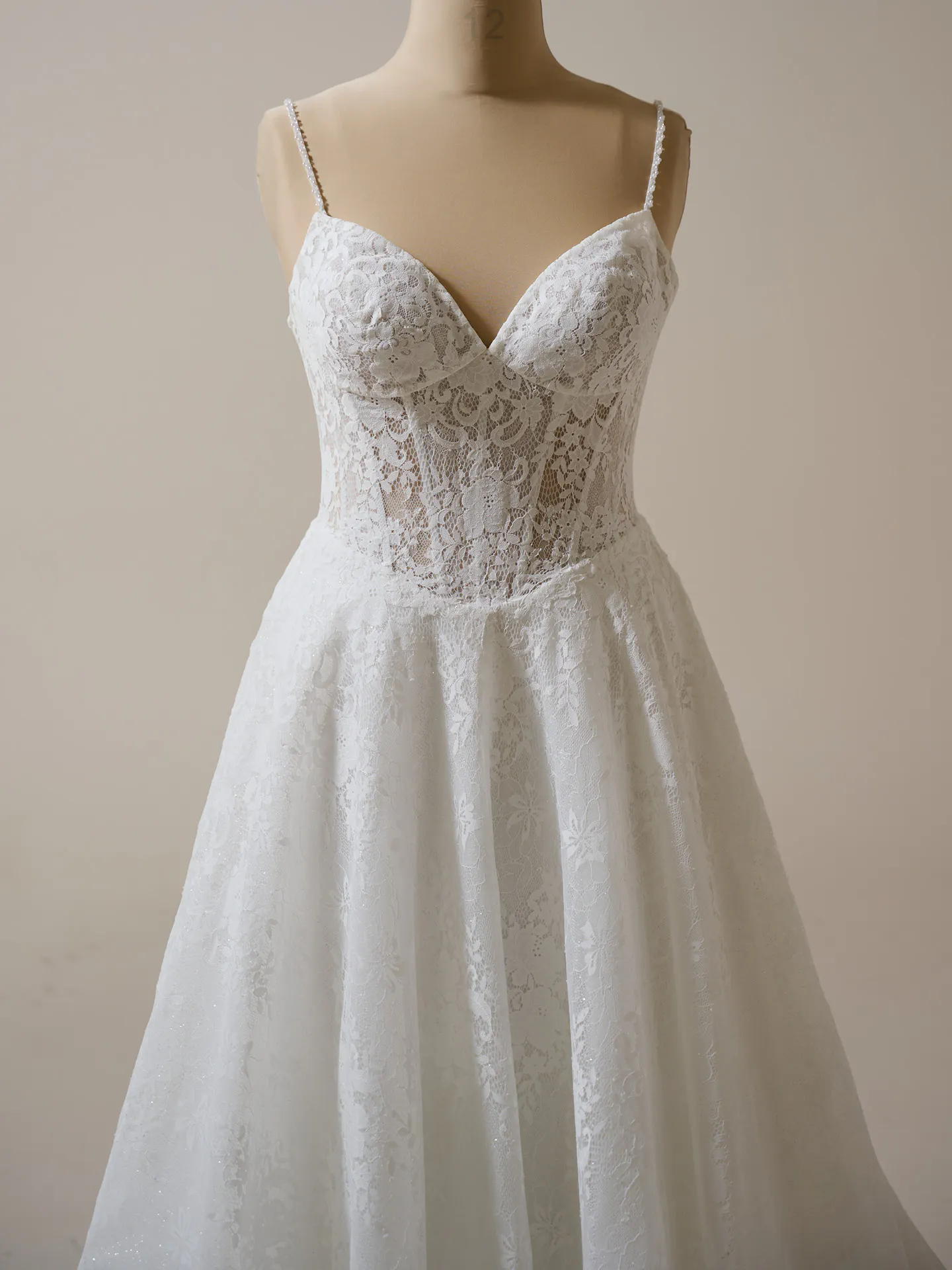 Maggie Sottero Narissa front view lace A-line bridal gown on mannequin