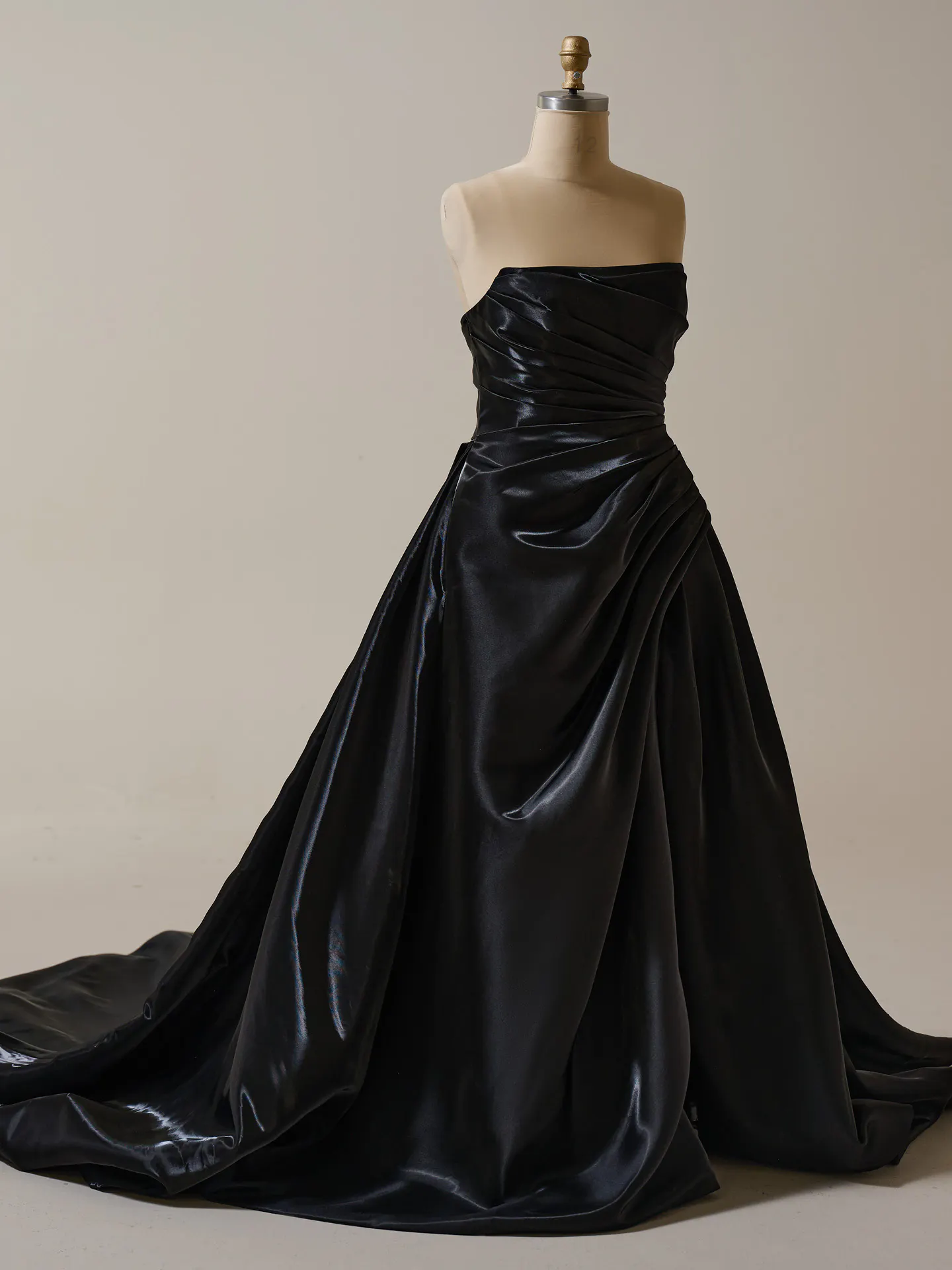 Sottero and Midgley black asymmetrical pleated A-line gown front view