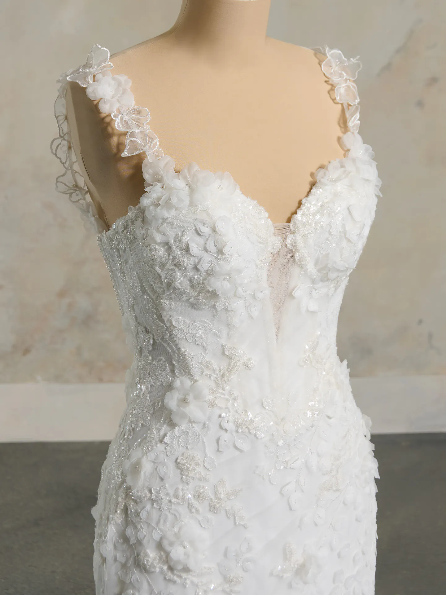 Floral tulle wedding gown close-up with delicate crisscross details