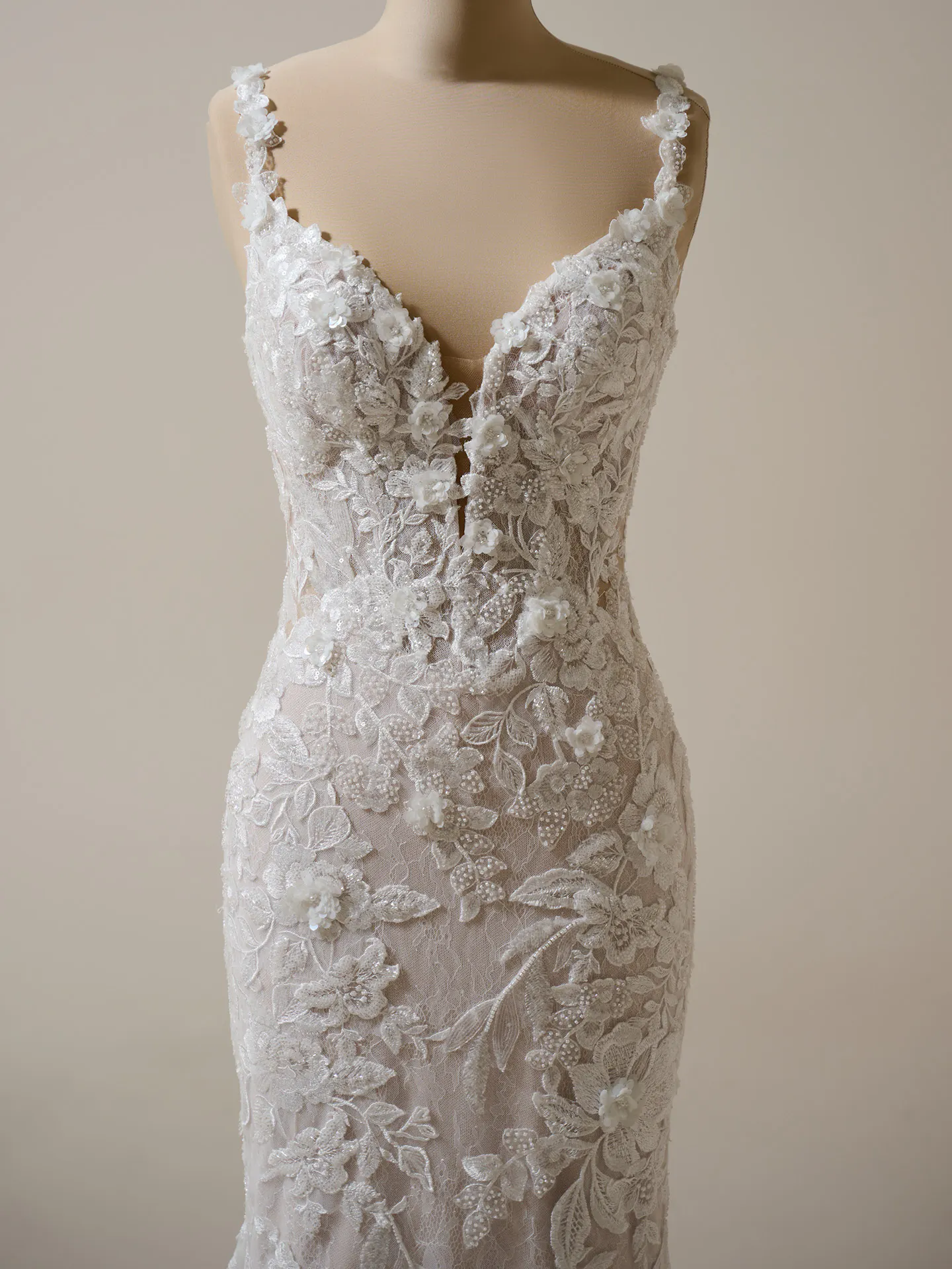 Adrian lace keyhole mermaid gown by Sottero and Midgley, front view, floral embellishments.