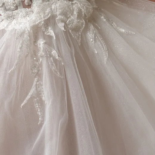 Maggie Sottero Arden detailed lace and tulle wedding dress close-up.