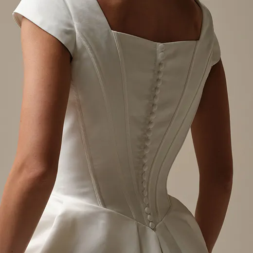Derrick Leigh back view, modest white ball gown, Maggie Sottero
