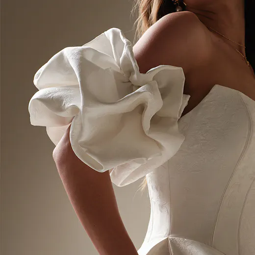Maggie Sottero Fortune Marie off-shoulder gown with ruffled sleeve detail
