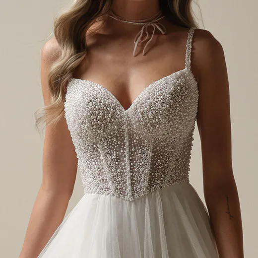 Gretchen pearl beaded bodice close-up, tulle A-line dress, Maggie Sottero.