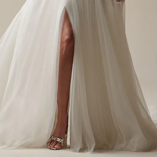 Maggie Sottero Gretchen A-line dress with slit front view.