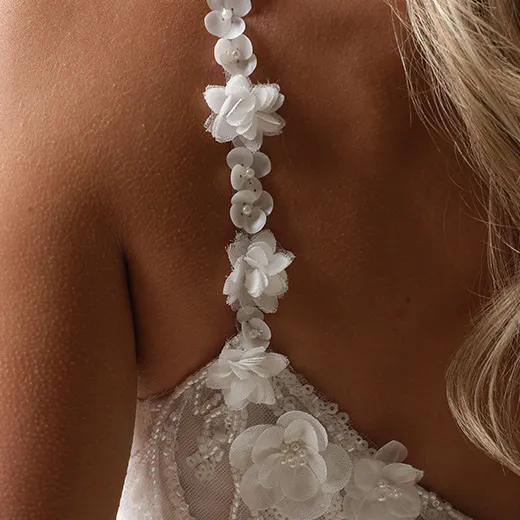 Maggie Sottero Hunter floral strap and lace detail wedding gown.