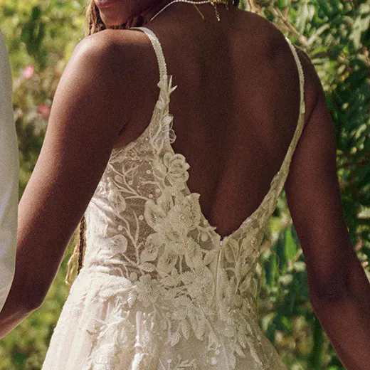 Jerrica A-line floral bridal dress back view, Maggie Sottero, garden setting.