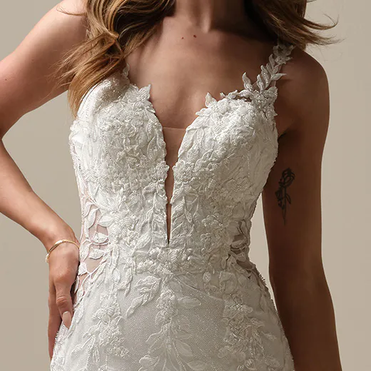 Maggie Sottero Keegan front view with lace details and illusion neckline