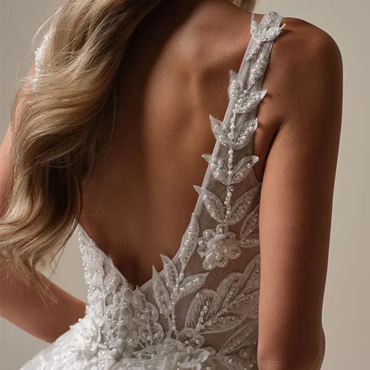 Maggie Sottero Magnolia back view with 3-D lace and sparkling floral details.